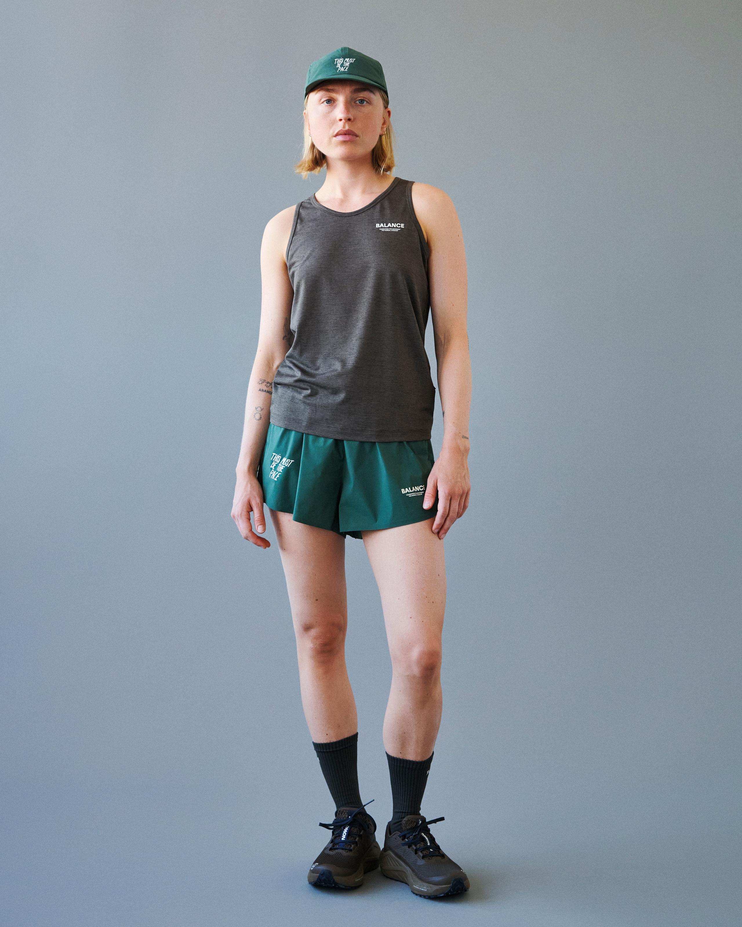 Brown Balance singlet on model with white chest print