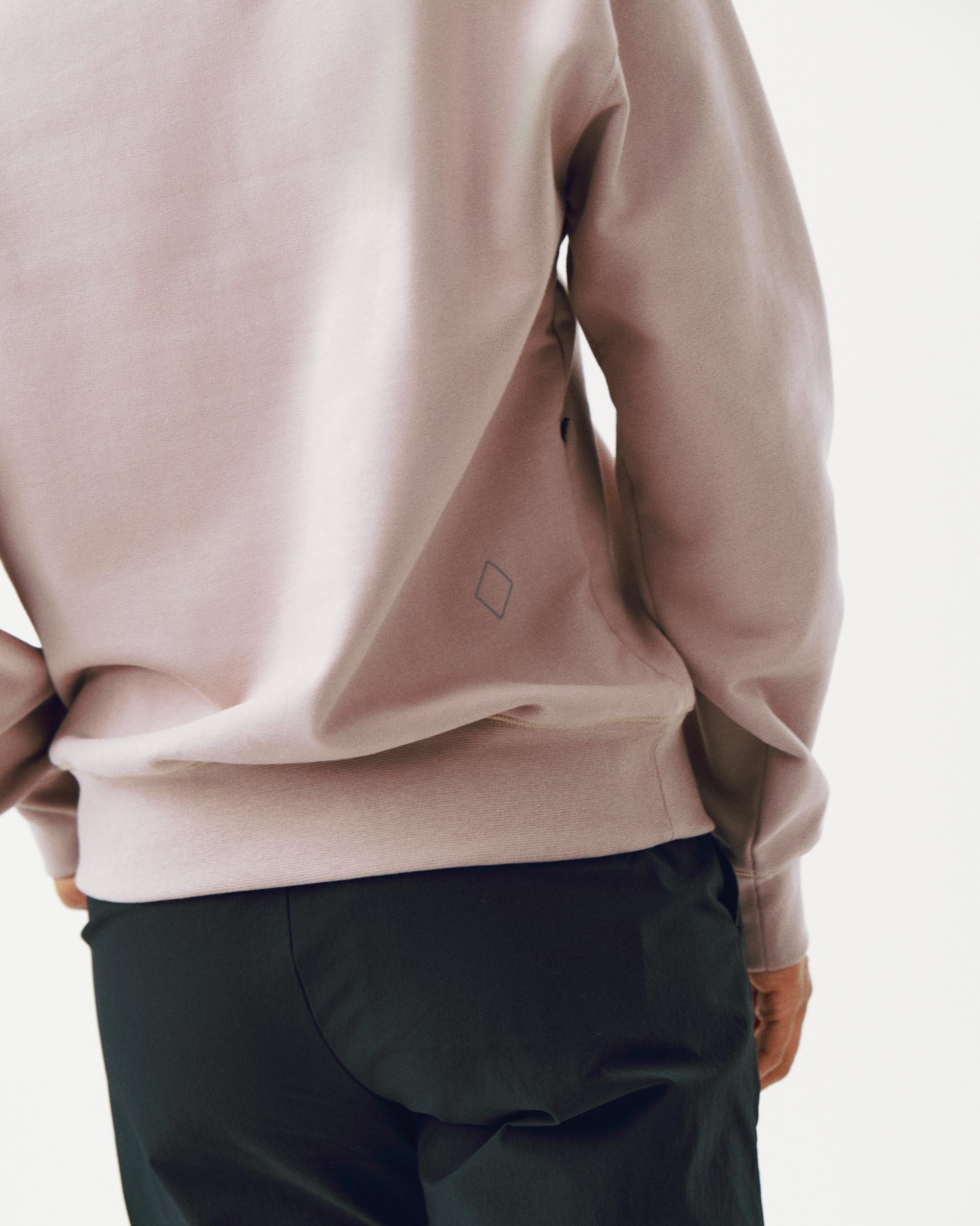 Pink Off-Race sweatshirt on model, rear view with small diamond logo on back