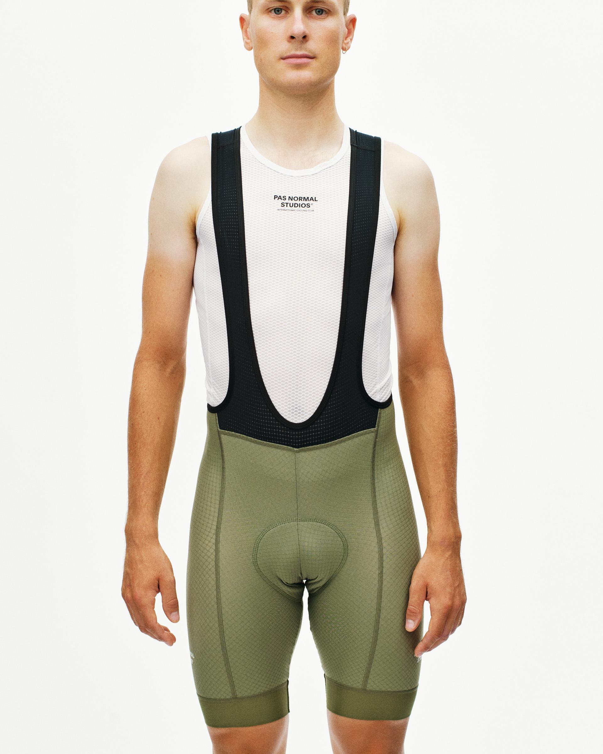 Light Olive Essential cycling bibs on model, front view with black mesh bib straps
