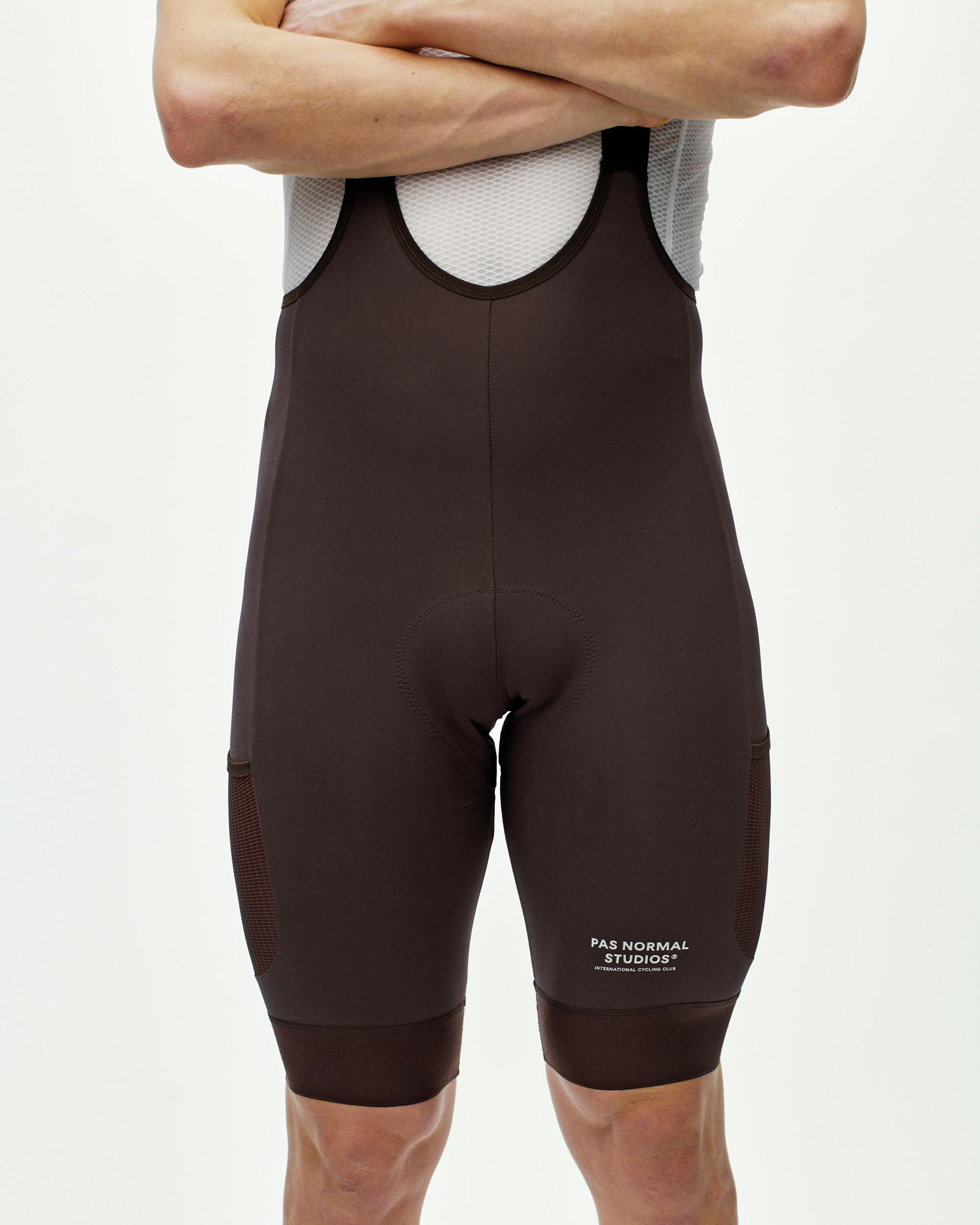 Dark Red Escapism Cargo cycling bibs on model with mesh back panel and side cargo pockets