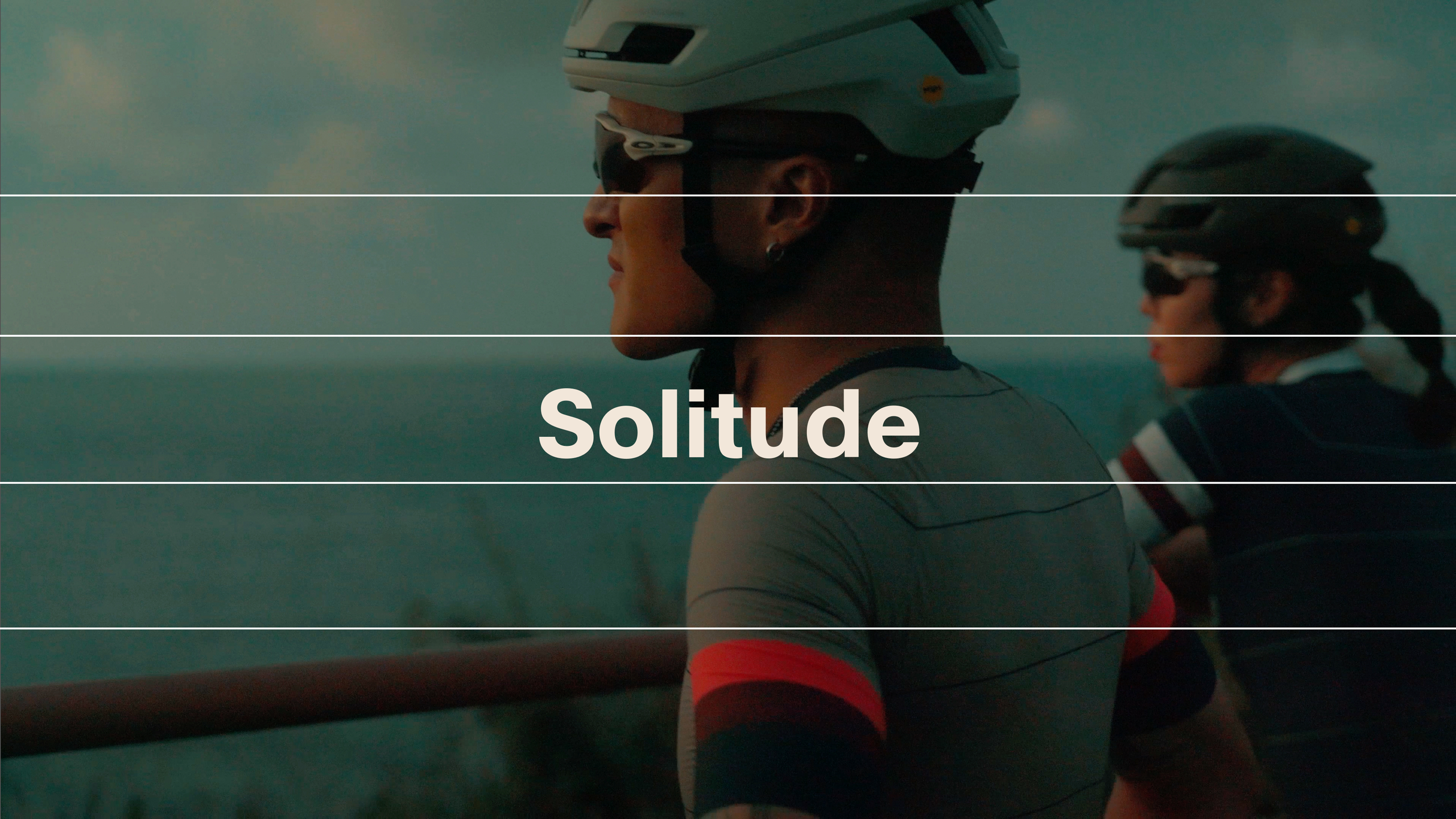 Cyclists wearing helmets and green jerseys with Solitude collection text overlay