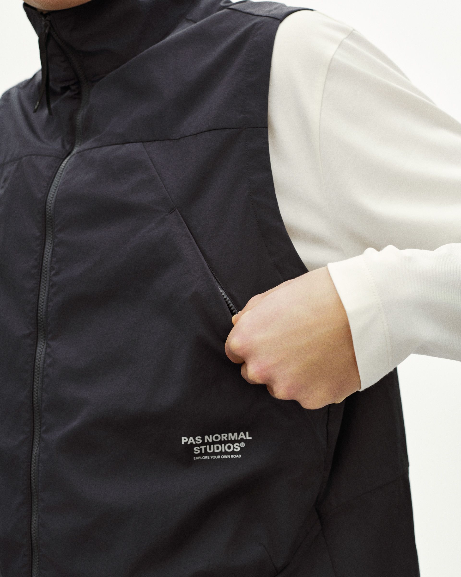 Grey Off-Race Utility vest on model with white contrast sleeves and chest logo