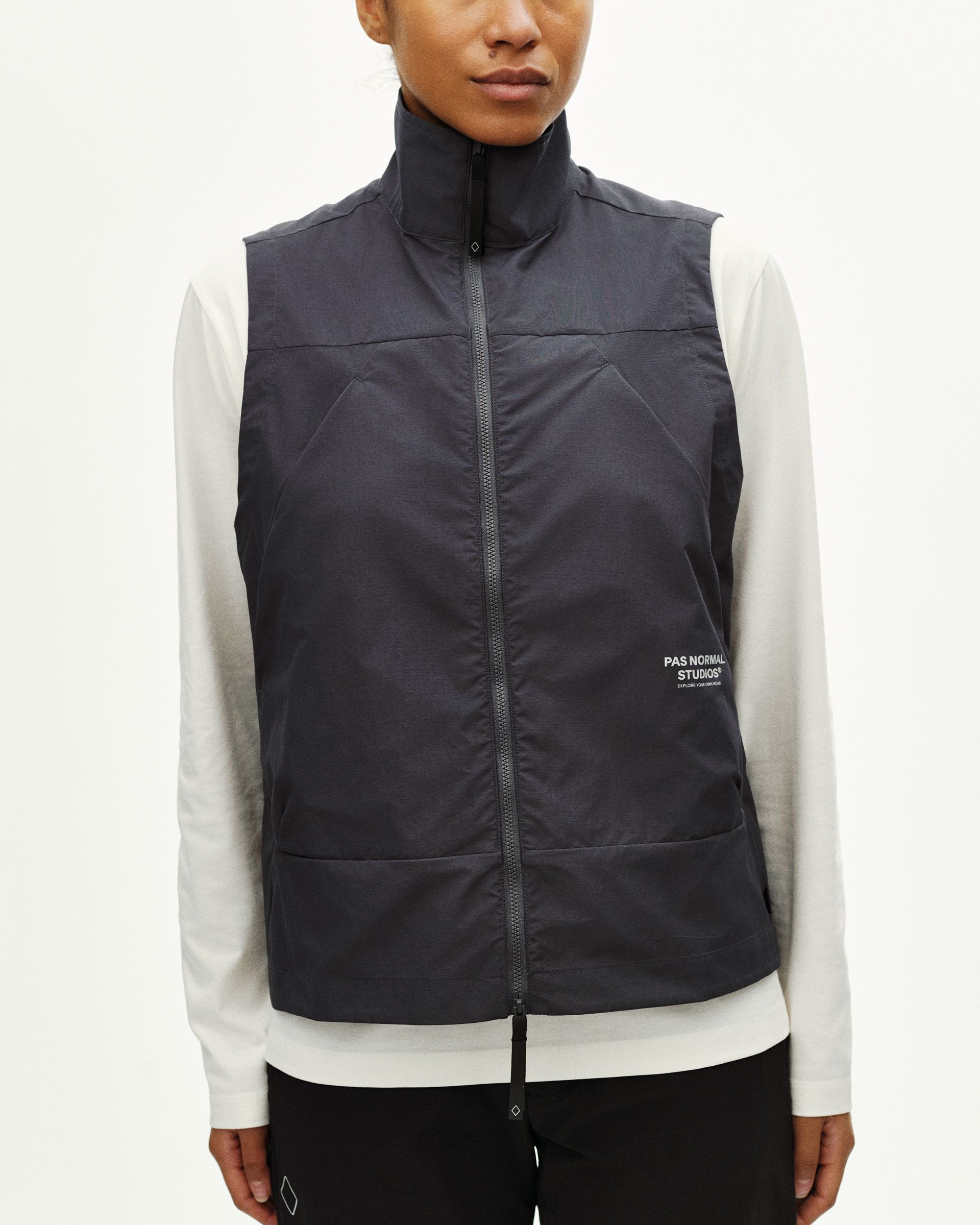 Grey Off-Race Utility vest on model, front view with white chest logo