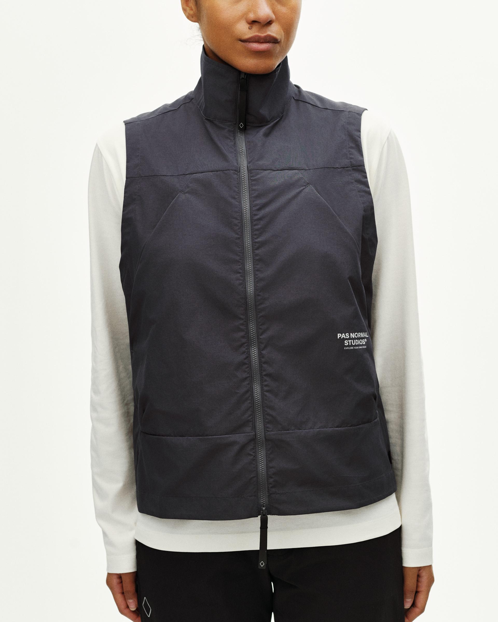 Grey Off-Race Utility vest on model, front view with white chest logo
