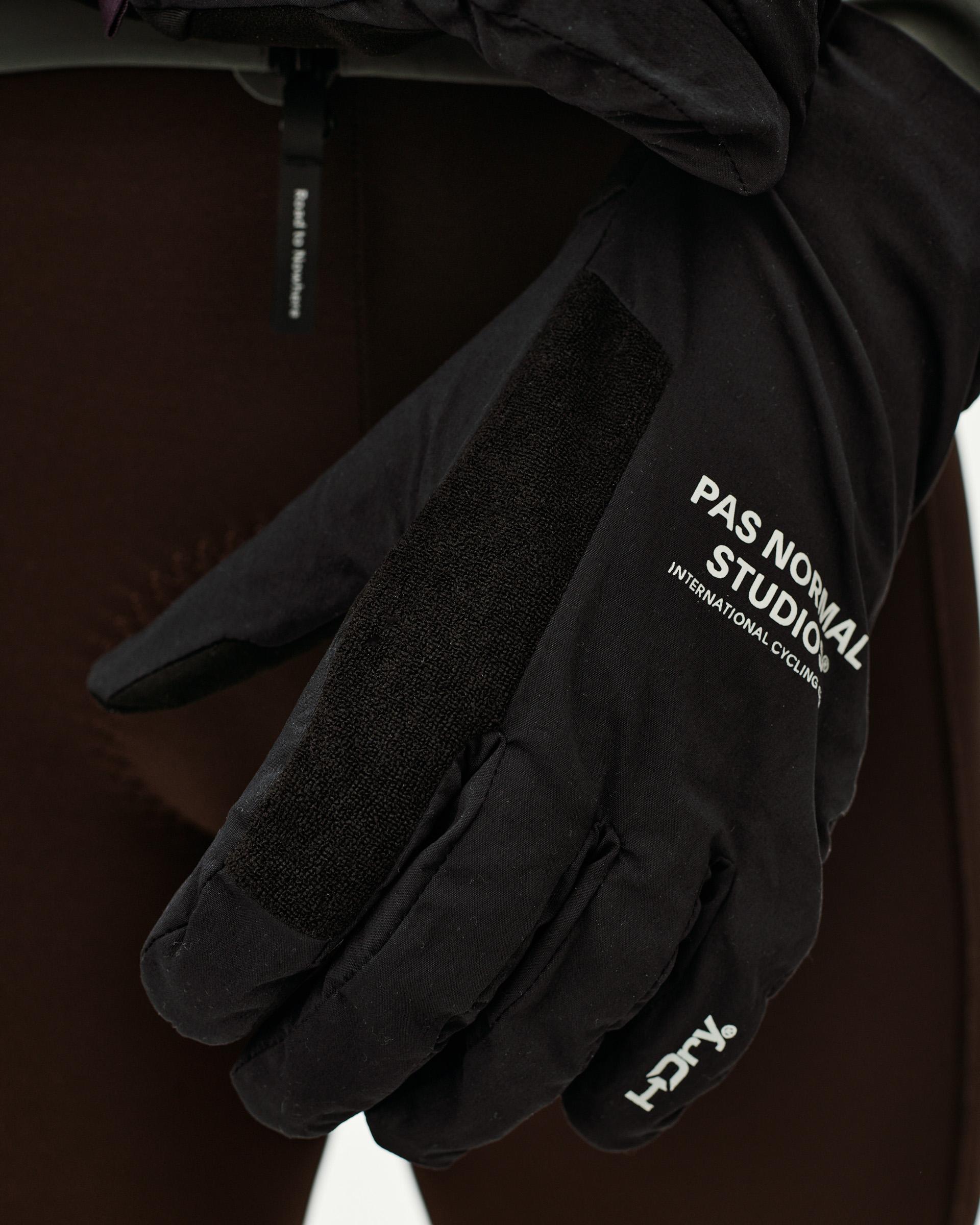 Black Logo Mid cycling gloves, detail view on model with white chest logo and velcro wrist strap