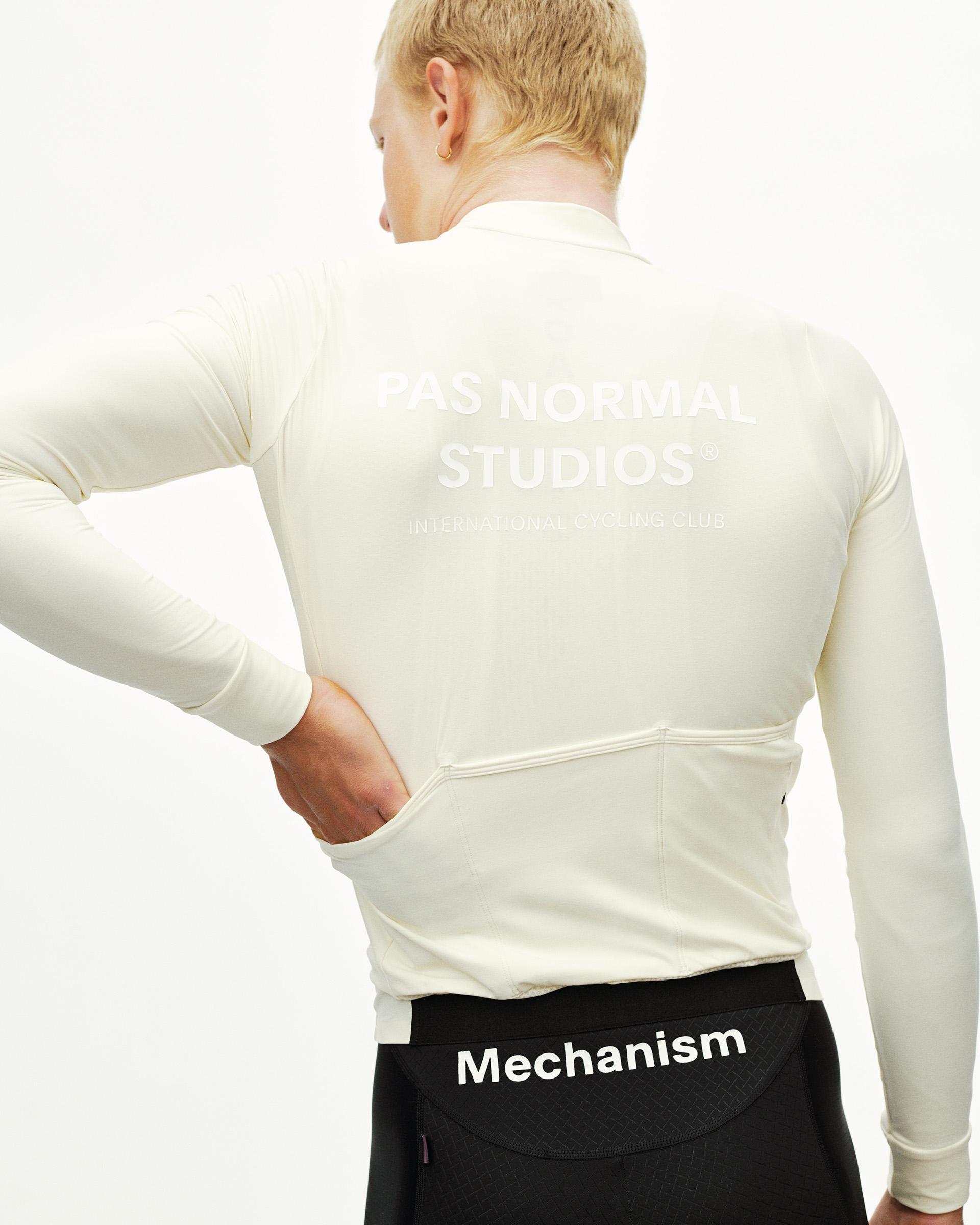 Off White Mechanism long sleeve cycling jersey on model, rear view with white back print and rear pockets