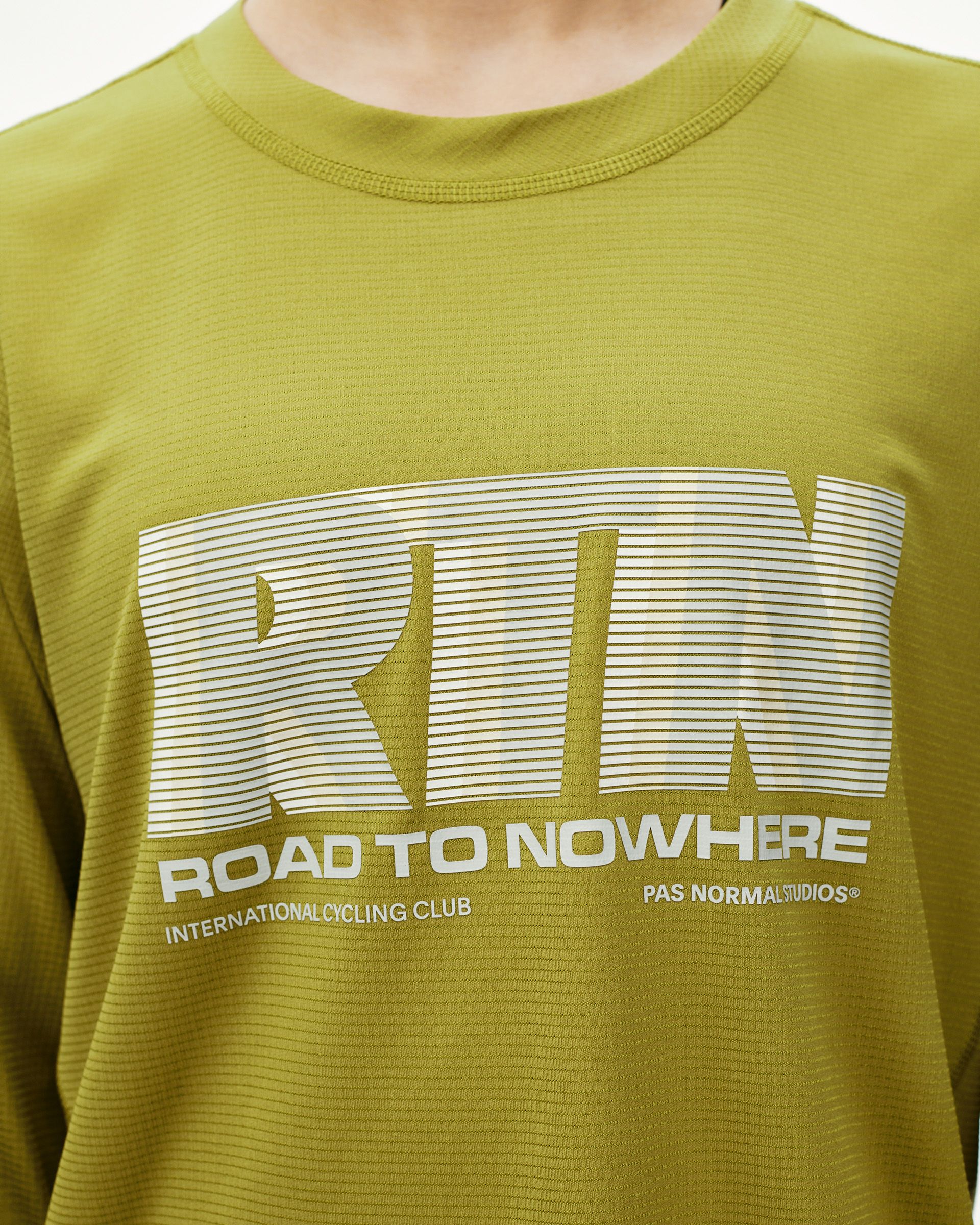 Dark Lime Balance long sleeve T-shirt, front detail on model with Road To Nowhere graphic print
