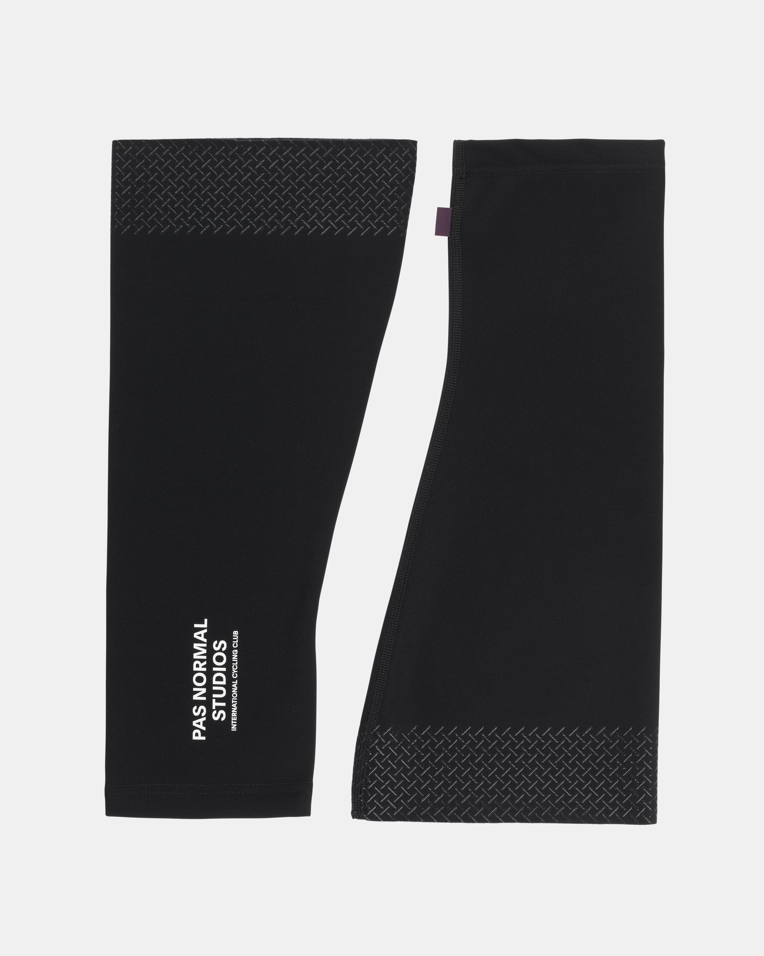 Black Logo knee warmers, flat lay pair with diamond pattern silicone grippers