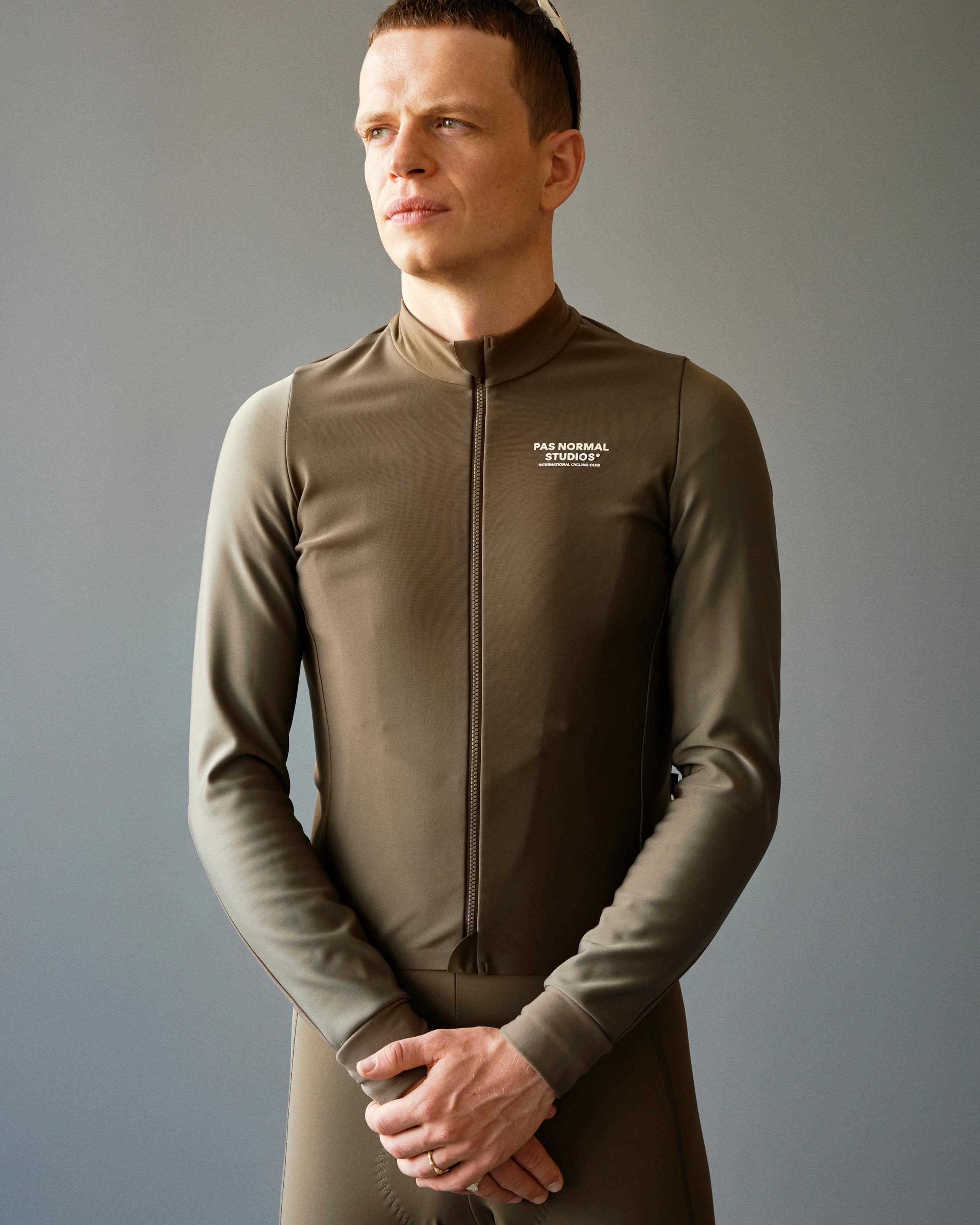 Earth Mechanism Thermal long sleeve cycling jersey on model with white chest logo