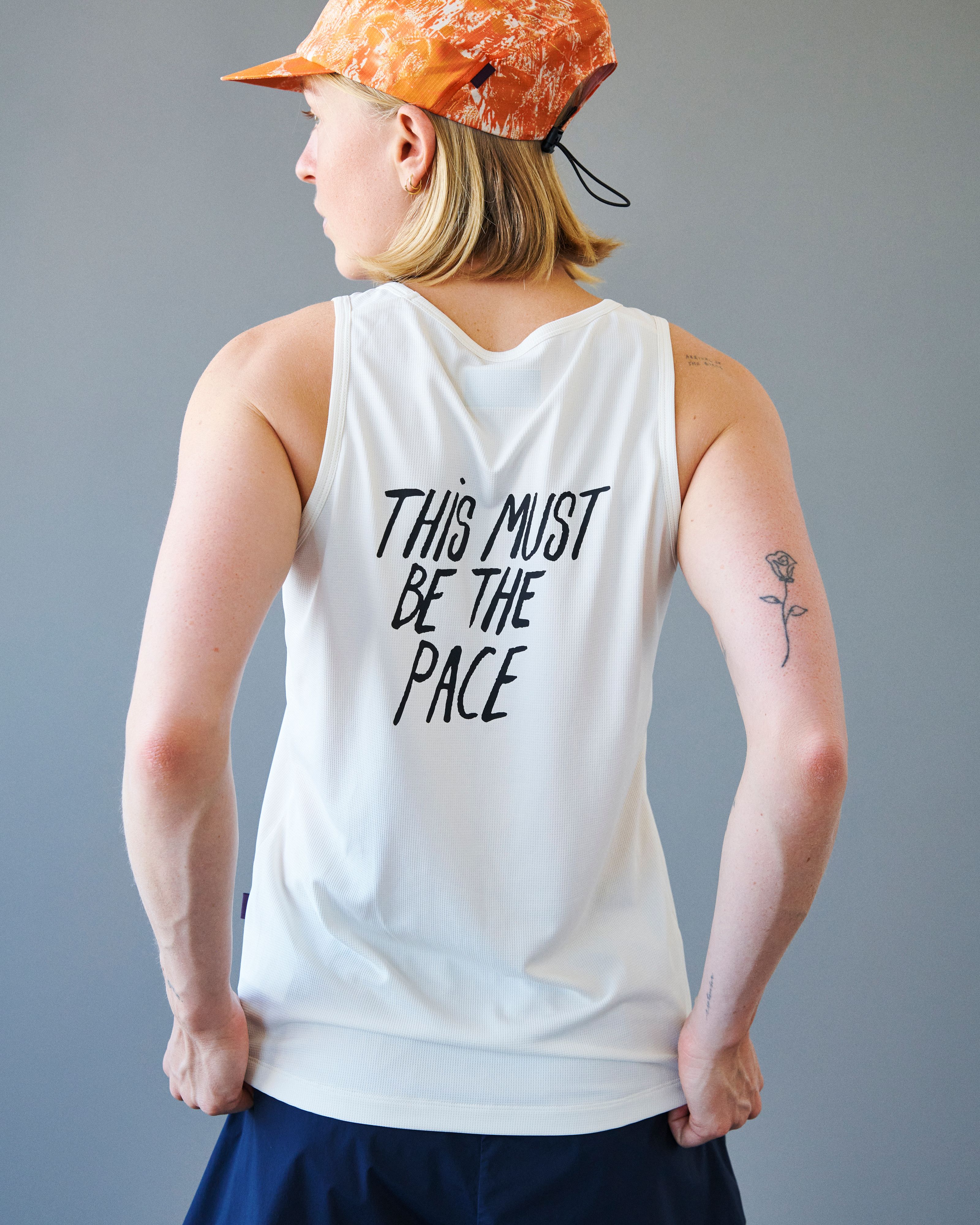 White Balance singlet on model, rear view with black text print