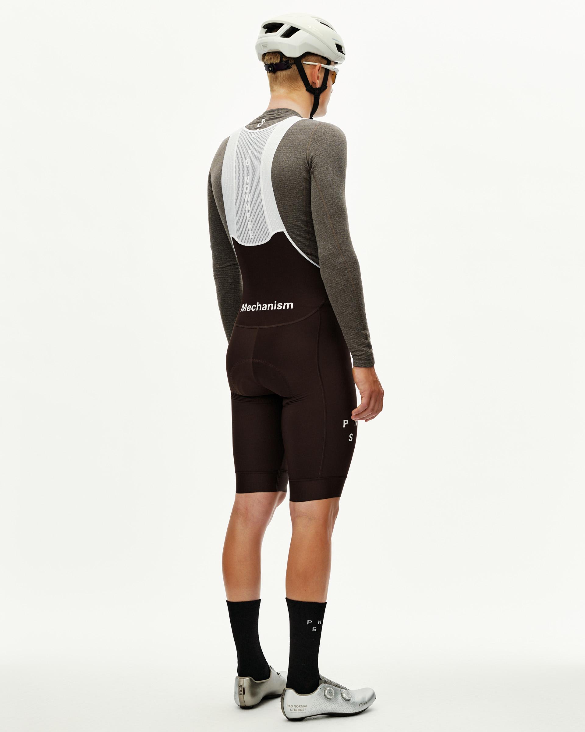 Dark Coffee Mechanism Thermal cycling bibs on model, rear view with white mesh bib straps