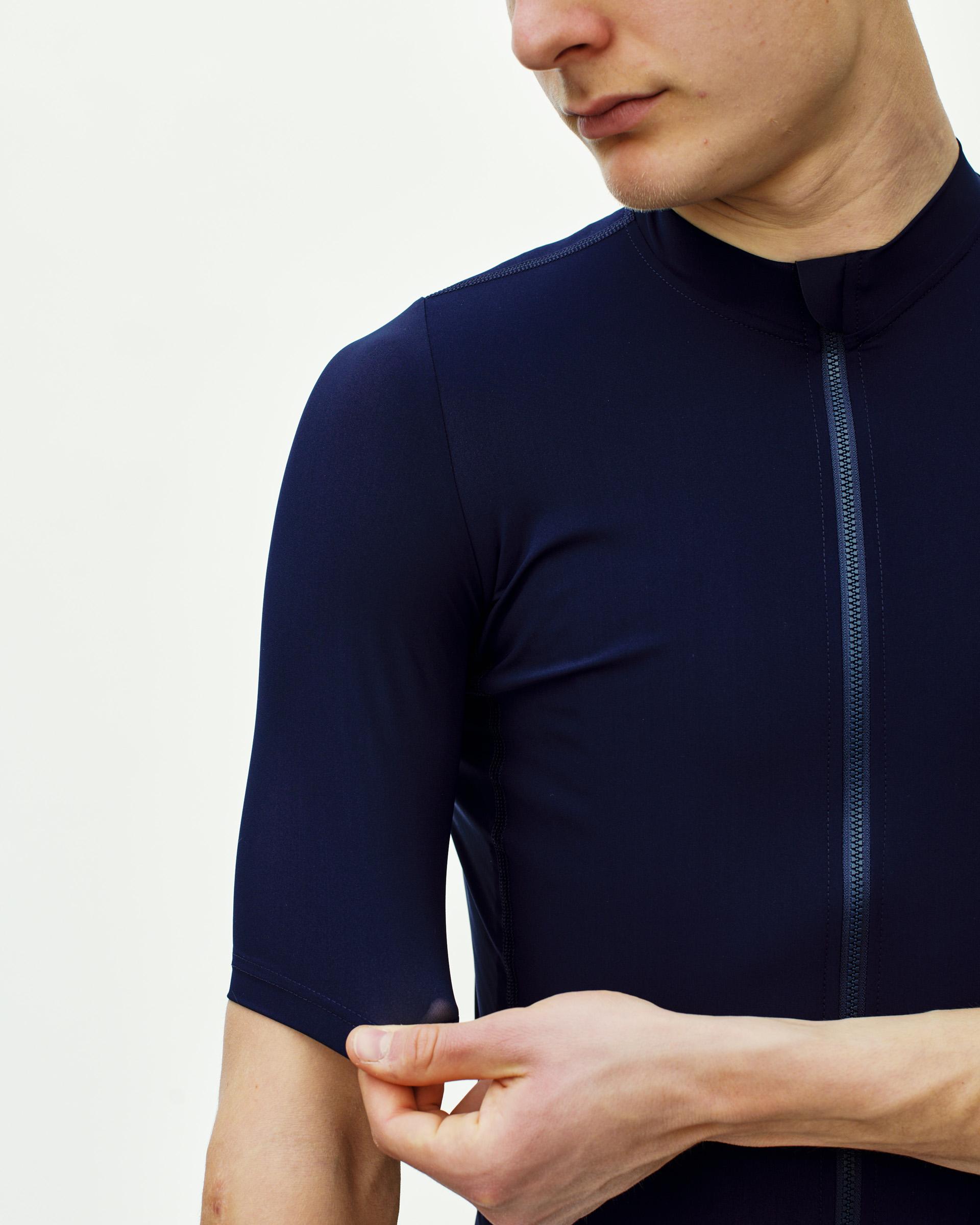 Navy Essential cycling jersey on model with front zip and short sleeves