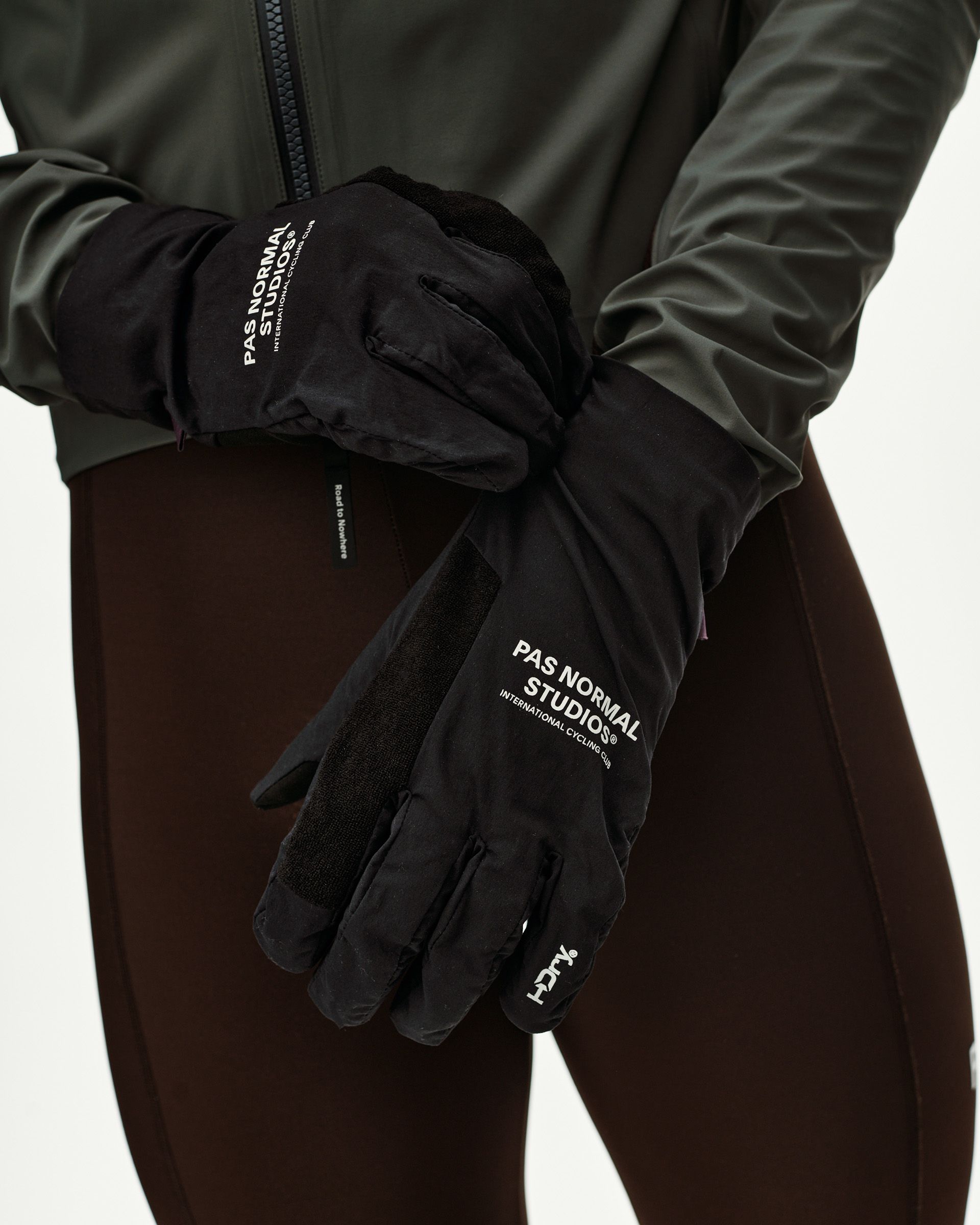 Black Logo Mid cycling gloves on model, front view with white logo print and suede palm panel