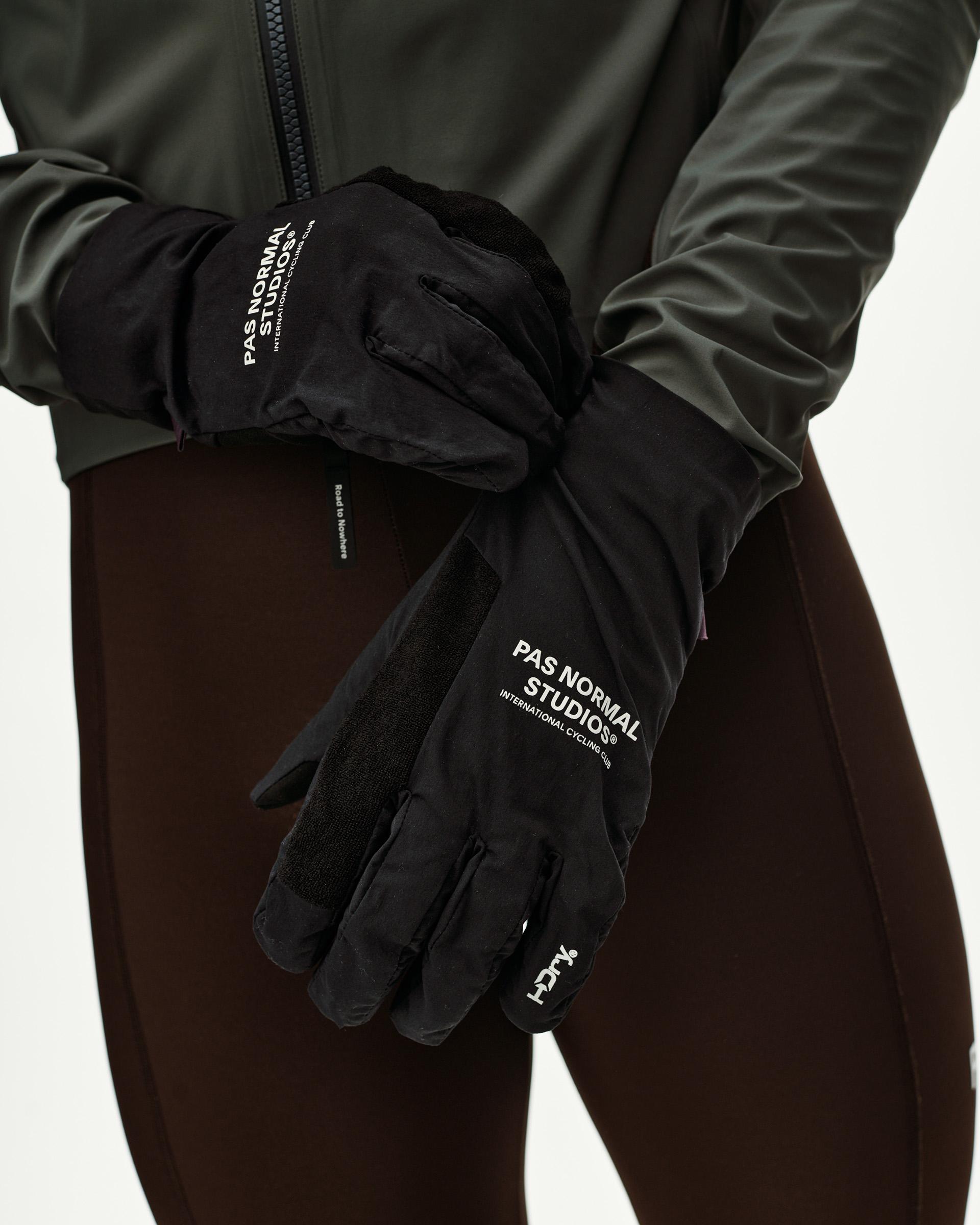 Black Logo Mid cycling gloves on model, front view with white logo print and suede palm panel