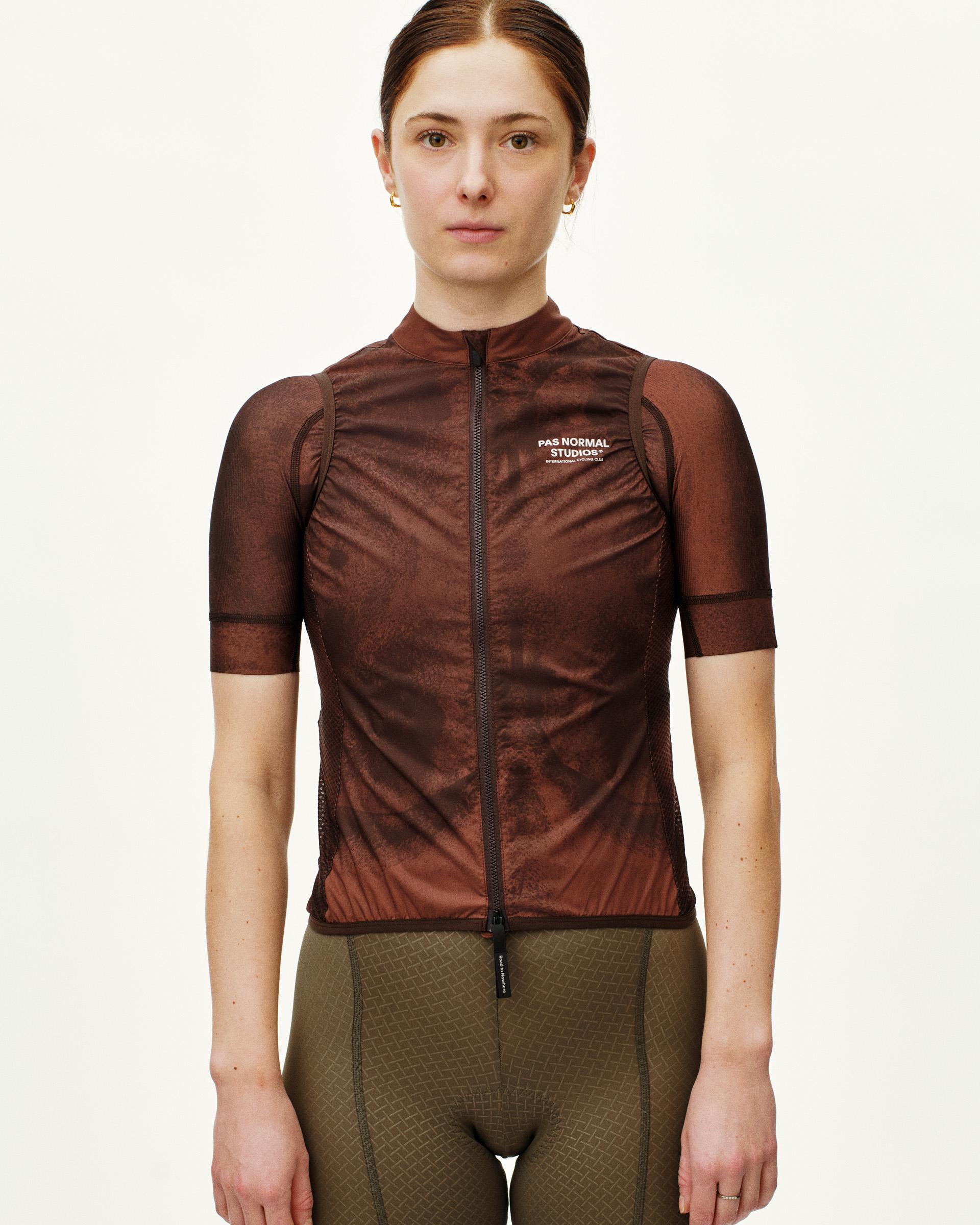 Light Brown Mechanism Stow Away gilet on model with palm leaf print