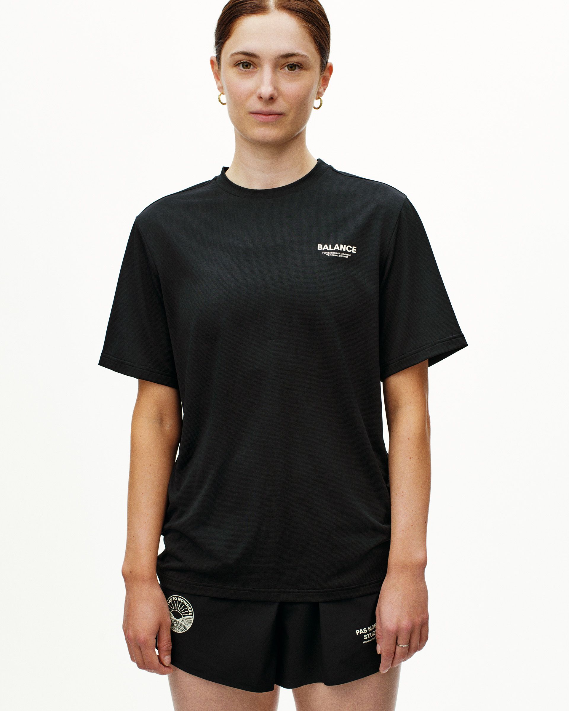 Black Balance t-shirt on model with white chest logo