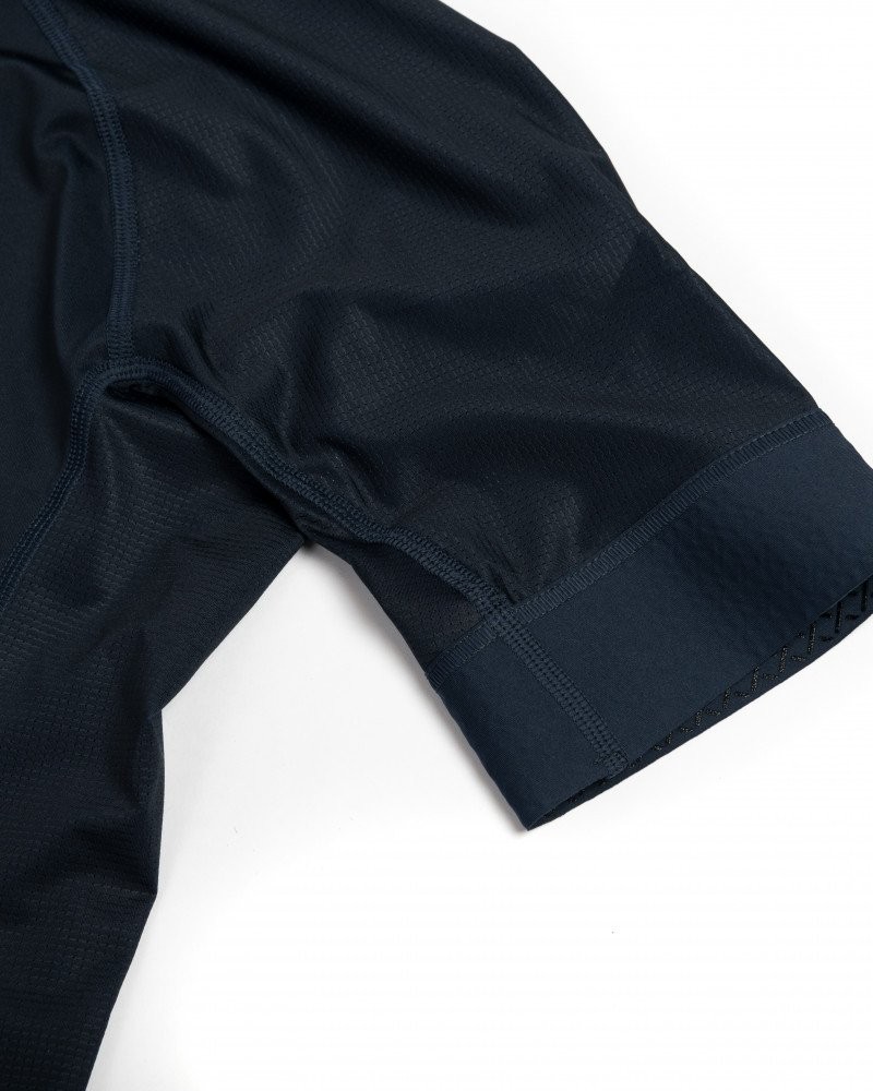 Dark Navy Mechanism cycling jersey sleeve detail with contrast stitching