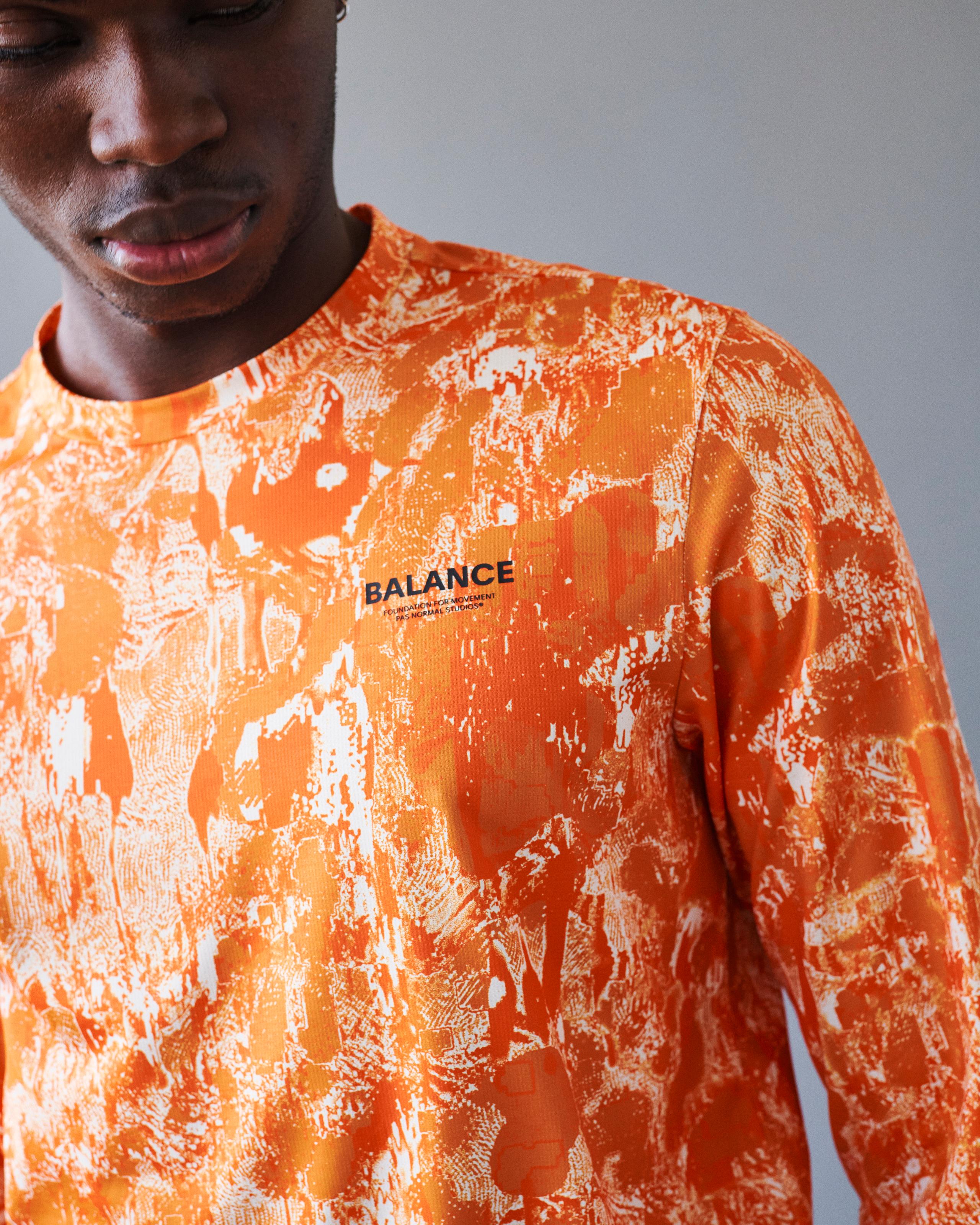 Orange Balance long sleeve t-shirt on model with white abstract print pattern