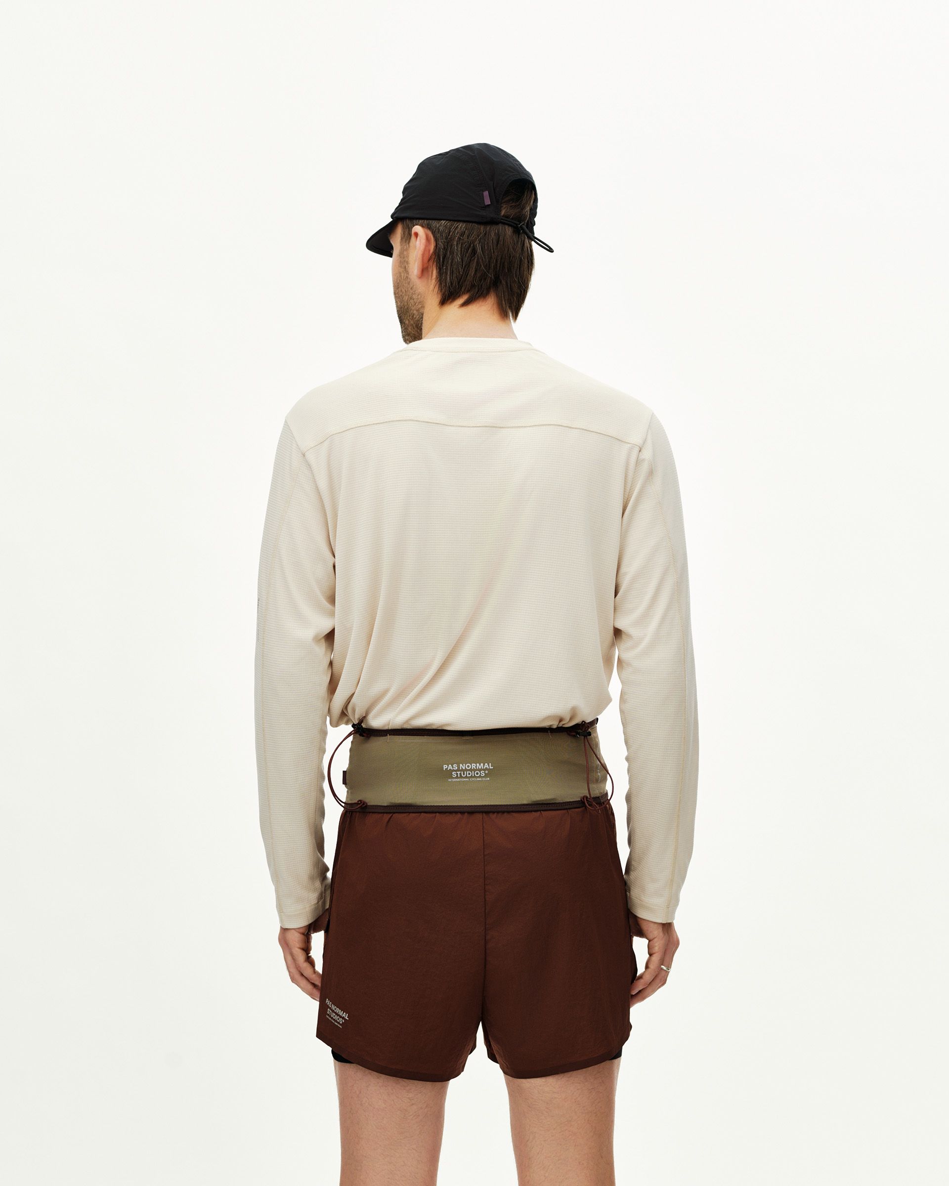 Light Brown Salomon S/LAB Belt on model, rear view with olive and brown two-tone body