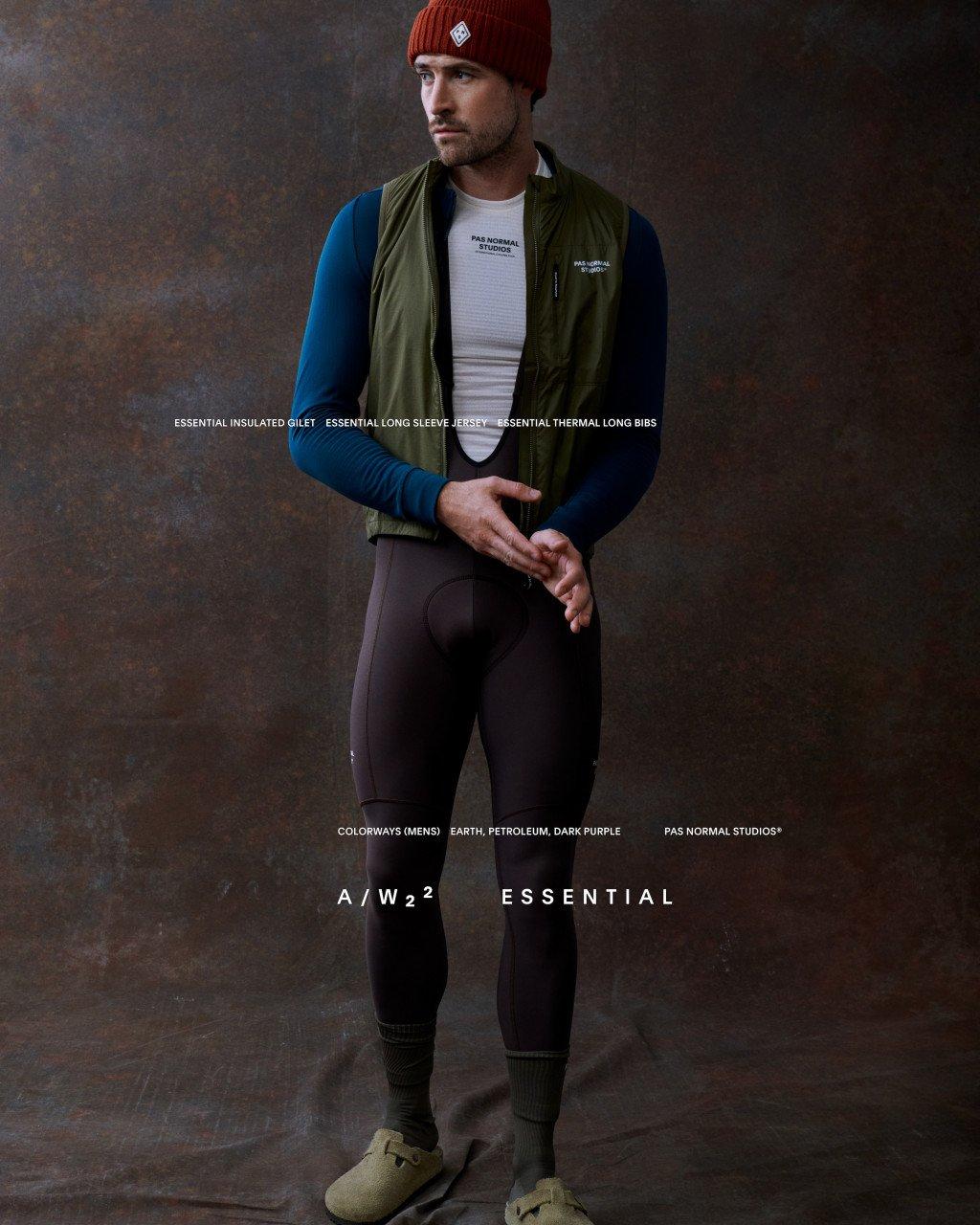 Model wearing Essential insulated gilet in olive green over blue long sleeve jersey and dark thermal bib tights