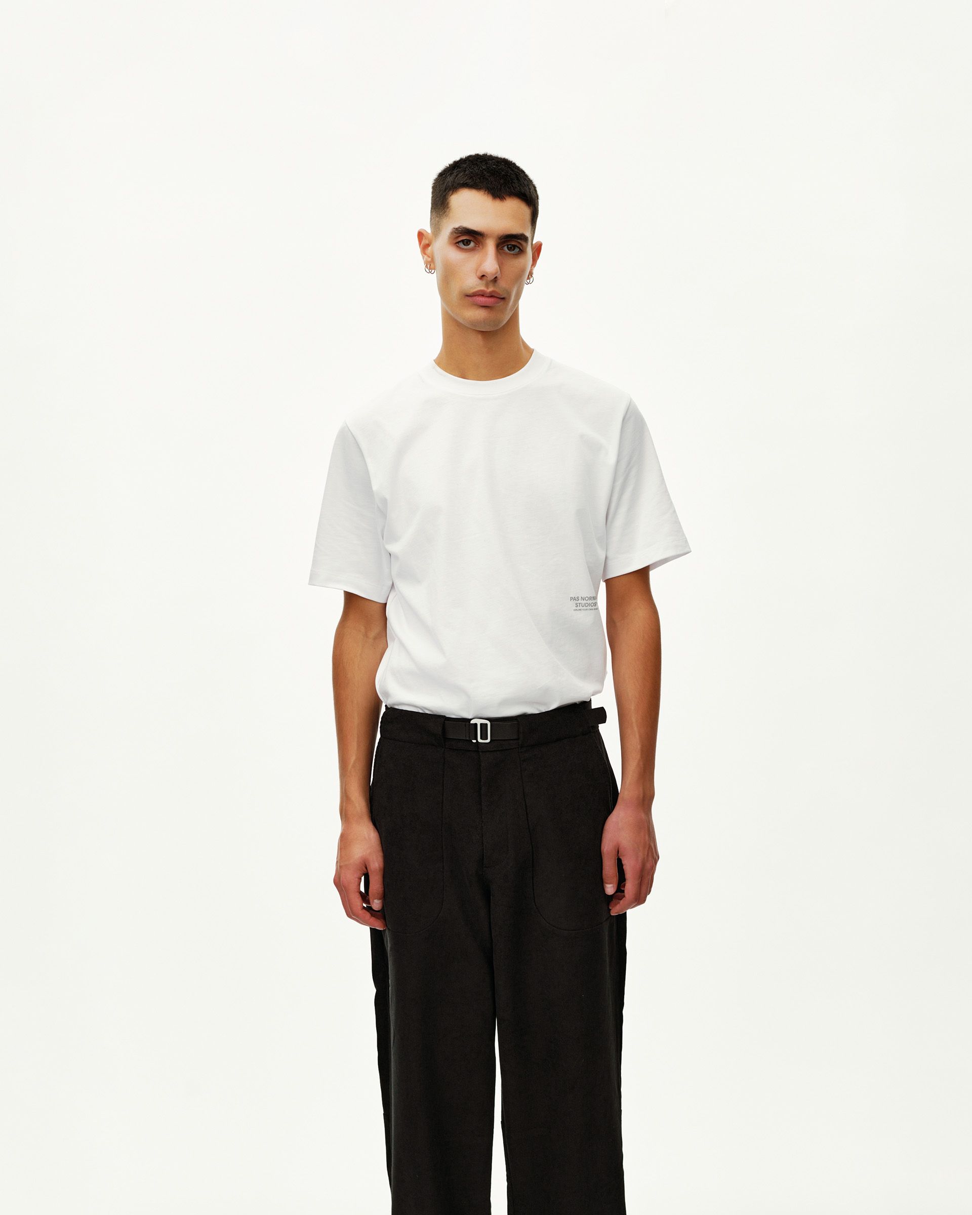Black Off-Race Corduroy pants on model, front view with belted waist and wide leg