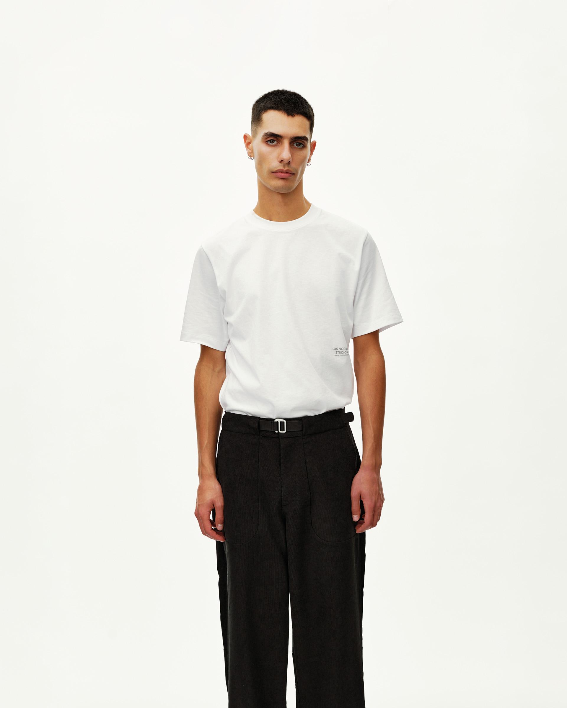 Black Off-Race Corduroy pants on model, front view with belted waist and wide leg