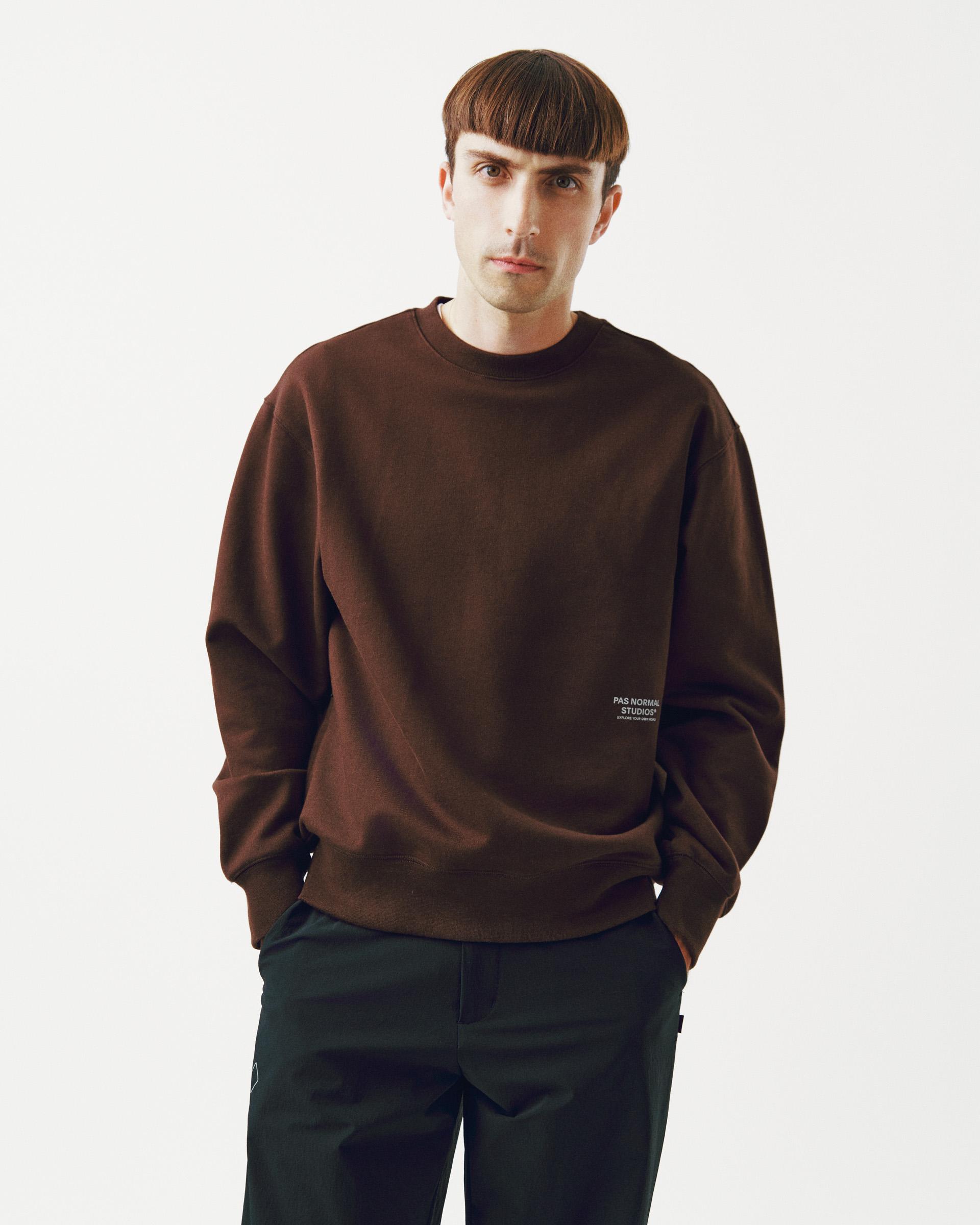 Light Brown Off-Race sweatshirt on model with small white chest logo
