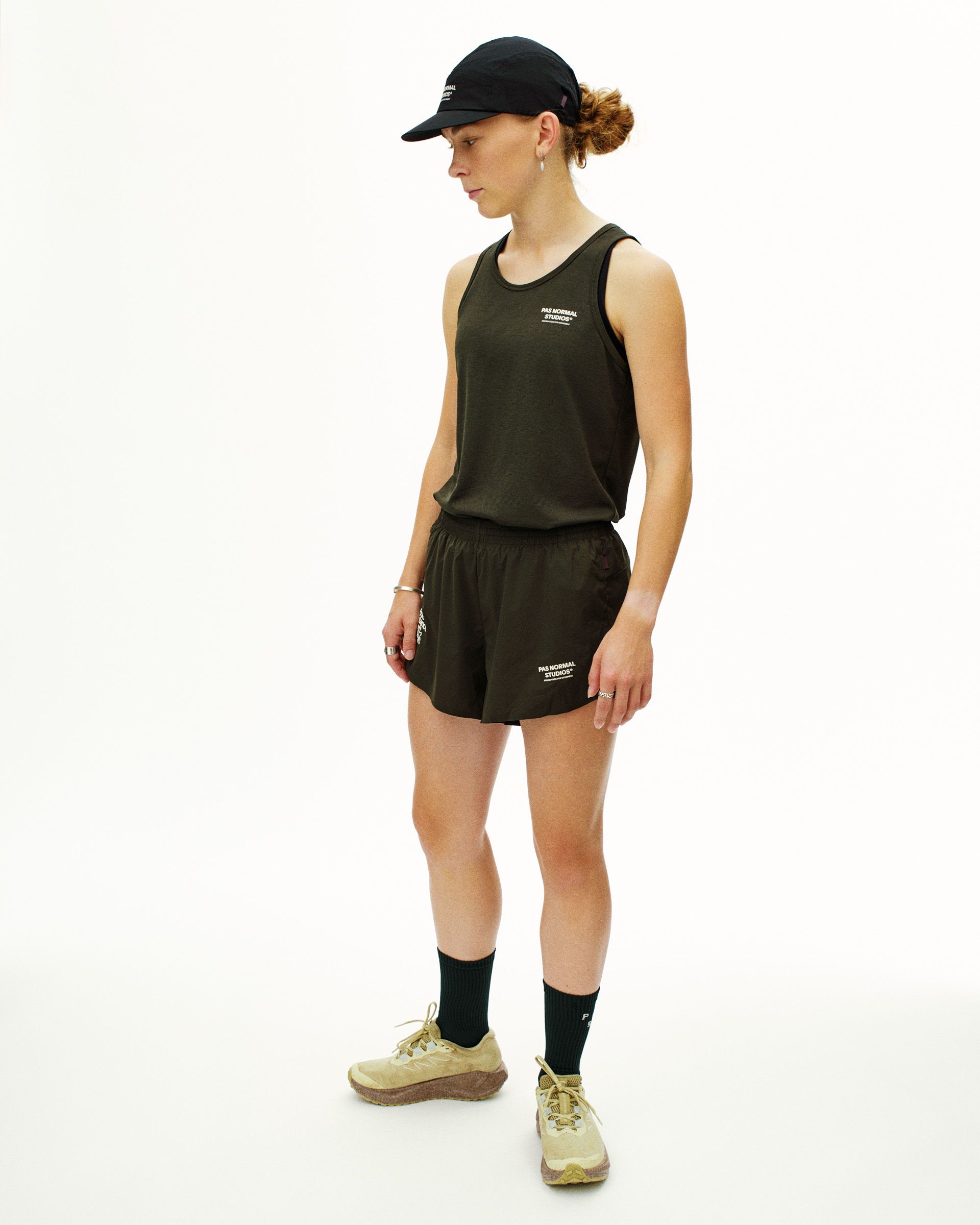 Dark Olive Balance singlet on model with side view and white chest logo