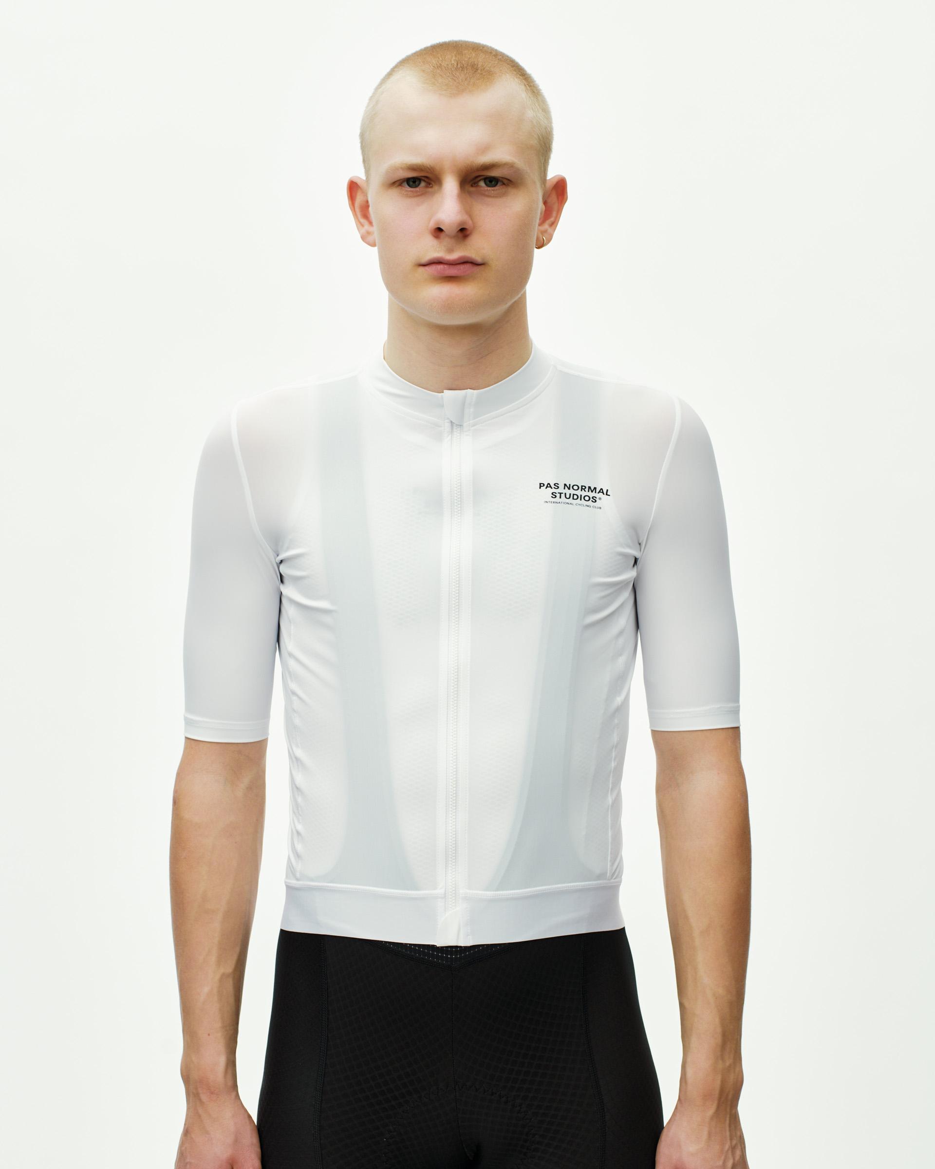 White Essential cycling jersey on model with full-zip front and chest logo