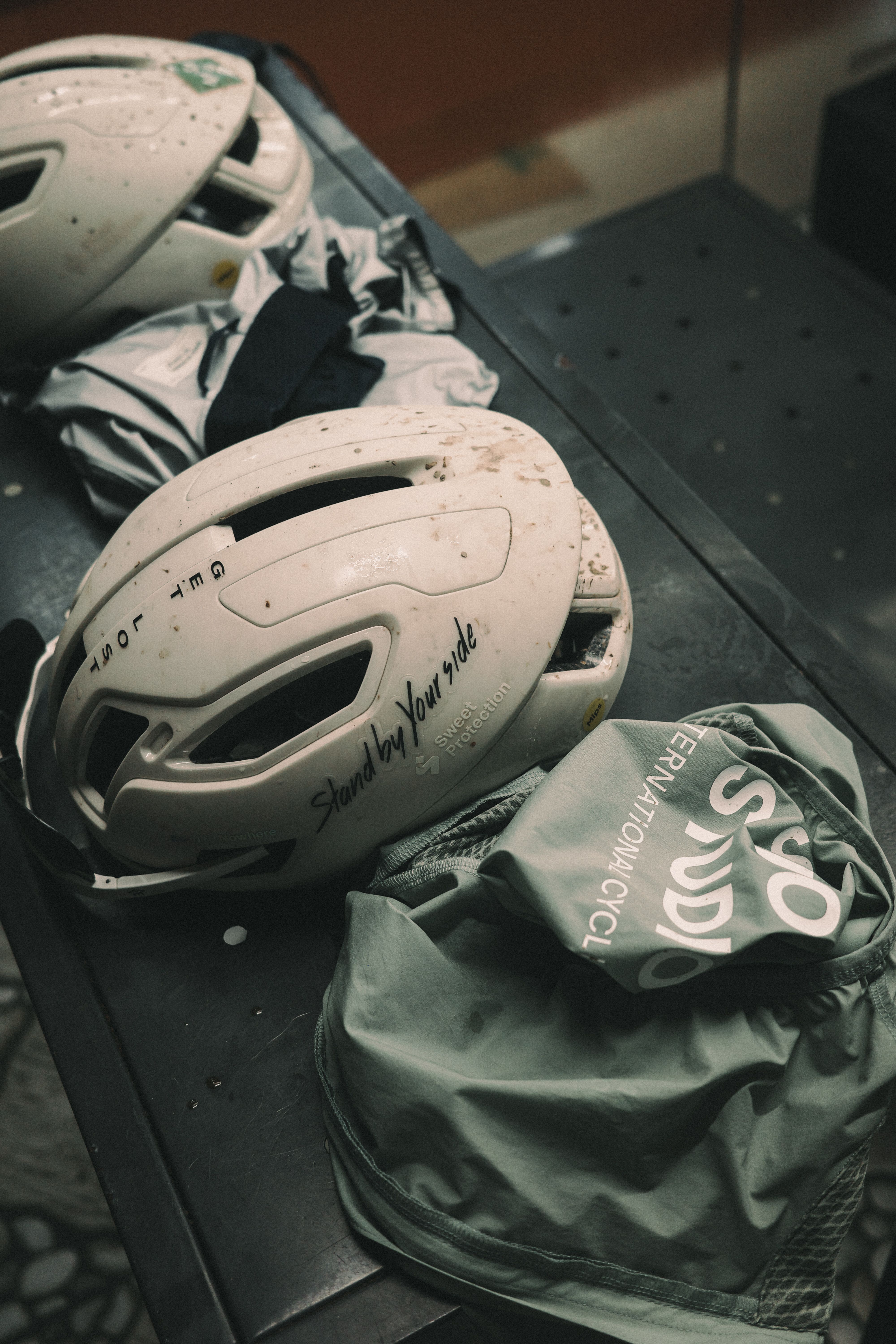 Cycling helmet and gear laid out in car trunk after ride
