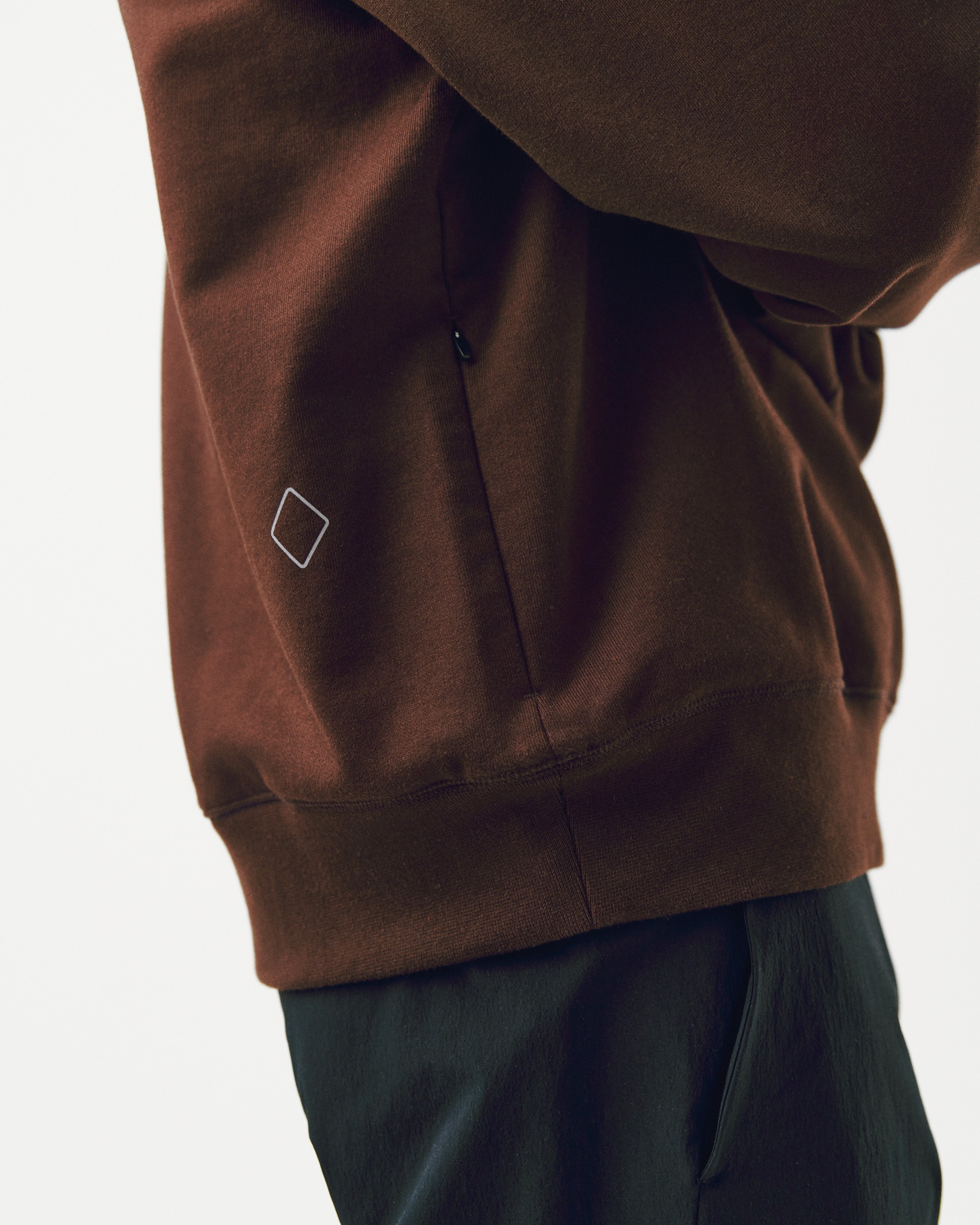 Light Brown Off-Race sweatshirt on model, side view showing zip pocket with white square logo
