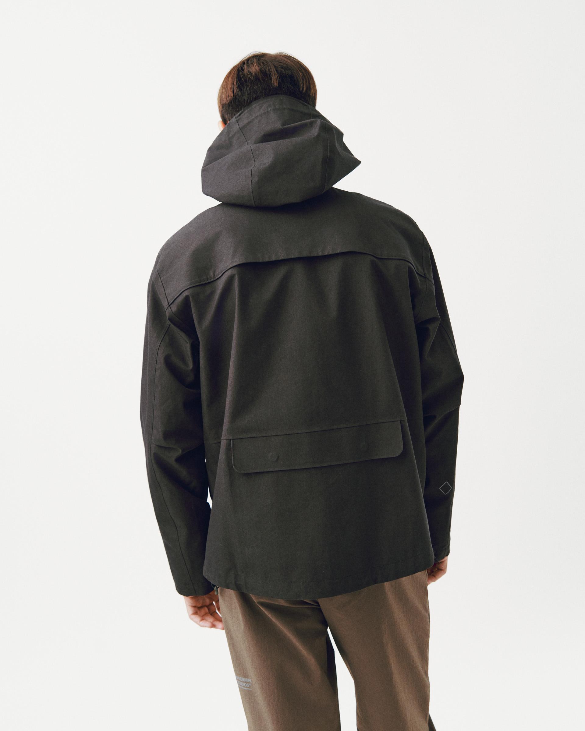Dark Olive Off-Race 3L Cotton Shell jacket, rear view on model with hood up