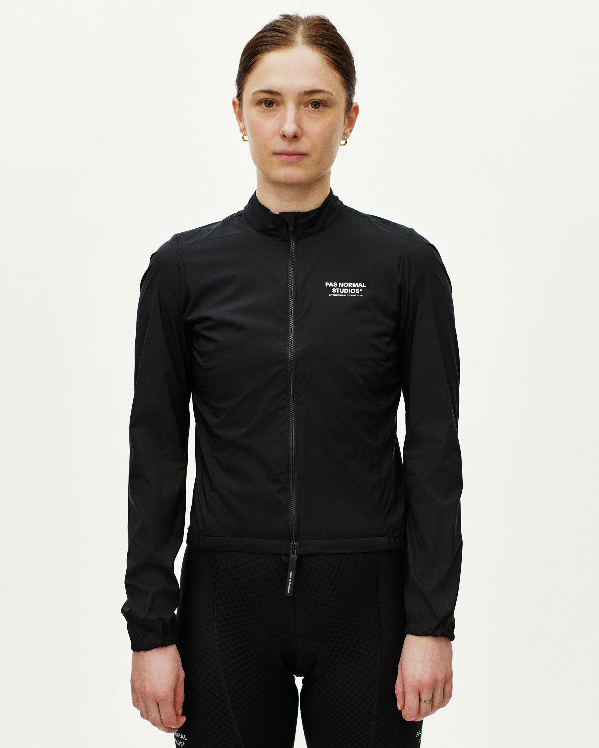 Black Essential Insulated cycling jacket on model, front view with white chest logo