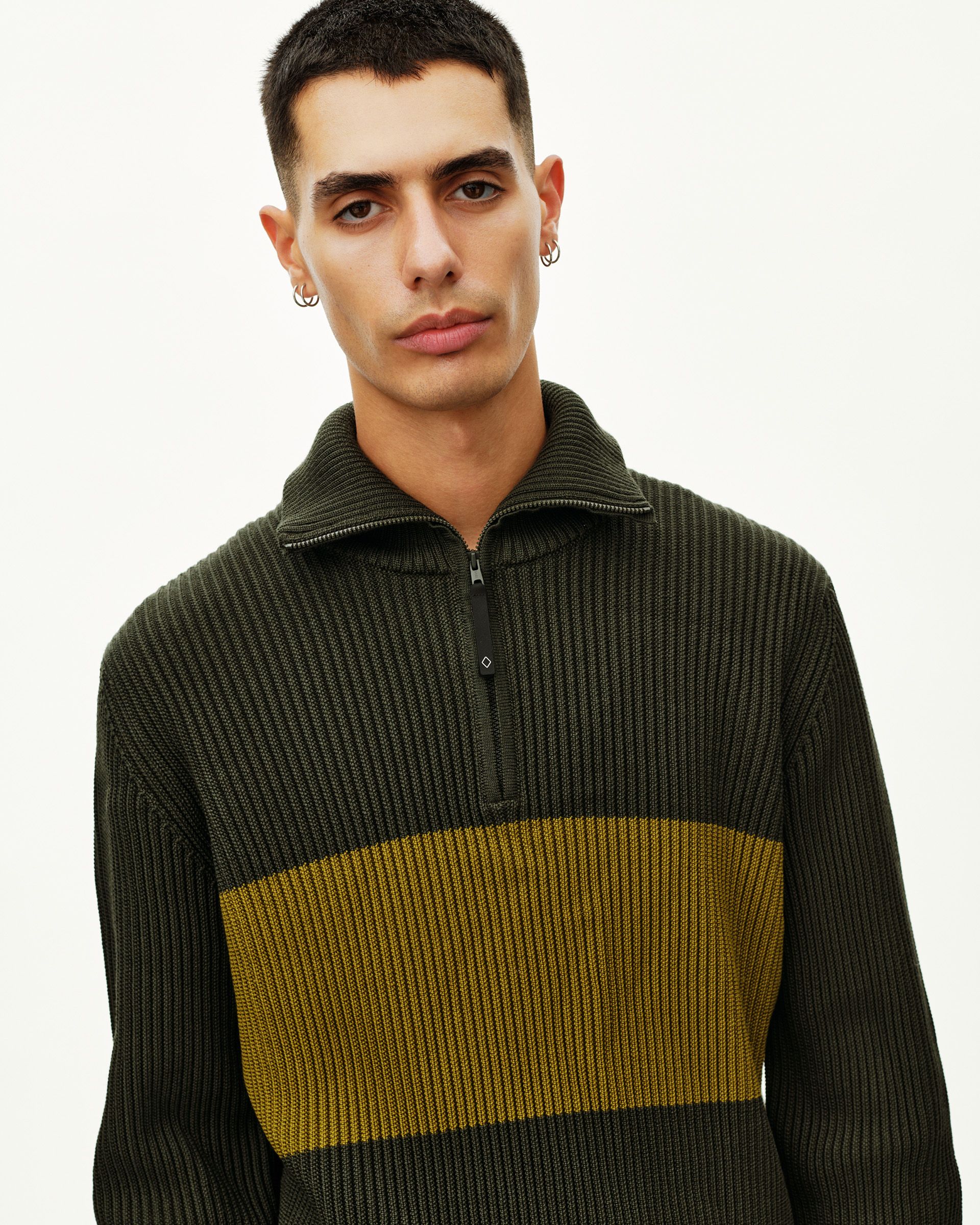 Olive Off-Race Merino Knit Half-Zip sweater on model, front view with contrast chest stripe
