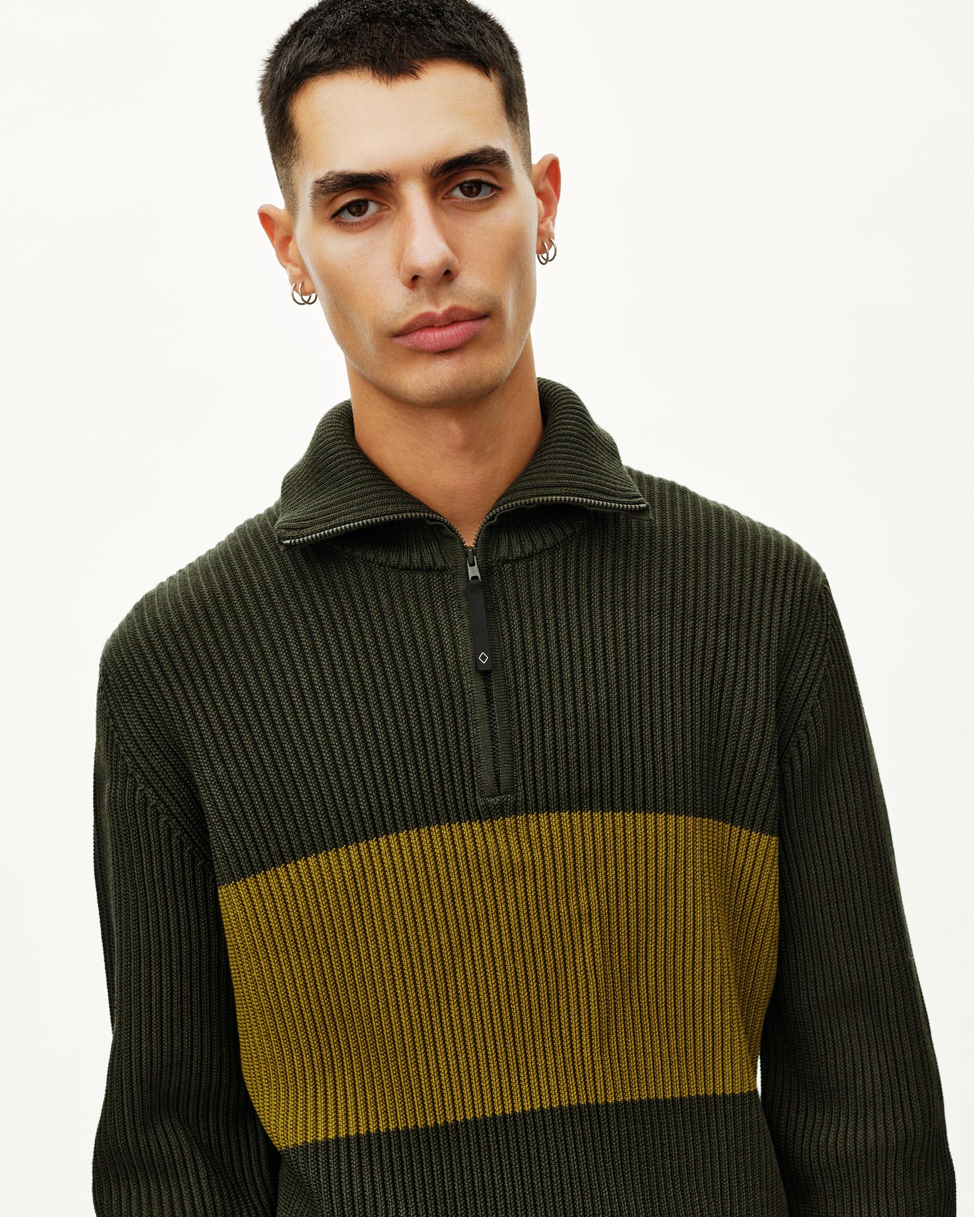 Olive Off-Race Merino Knit Half-Zip sweater on model, front view with contrast chest stripe