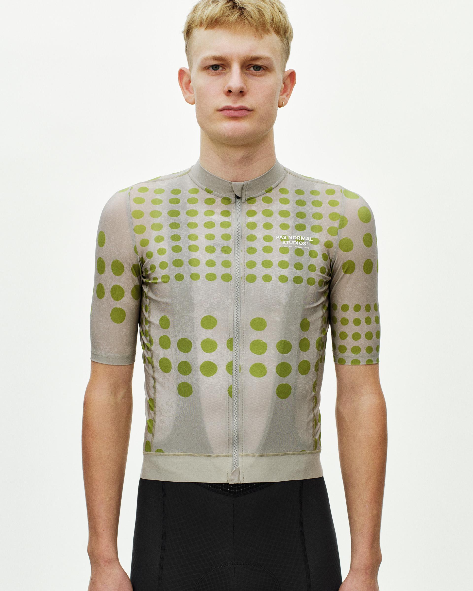 Bone Essential cycling jersey on model with green polka dot pattern