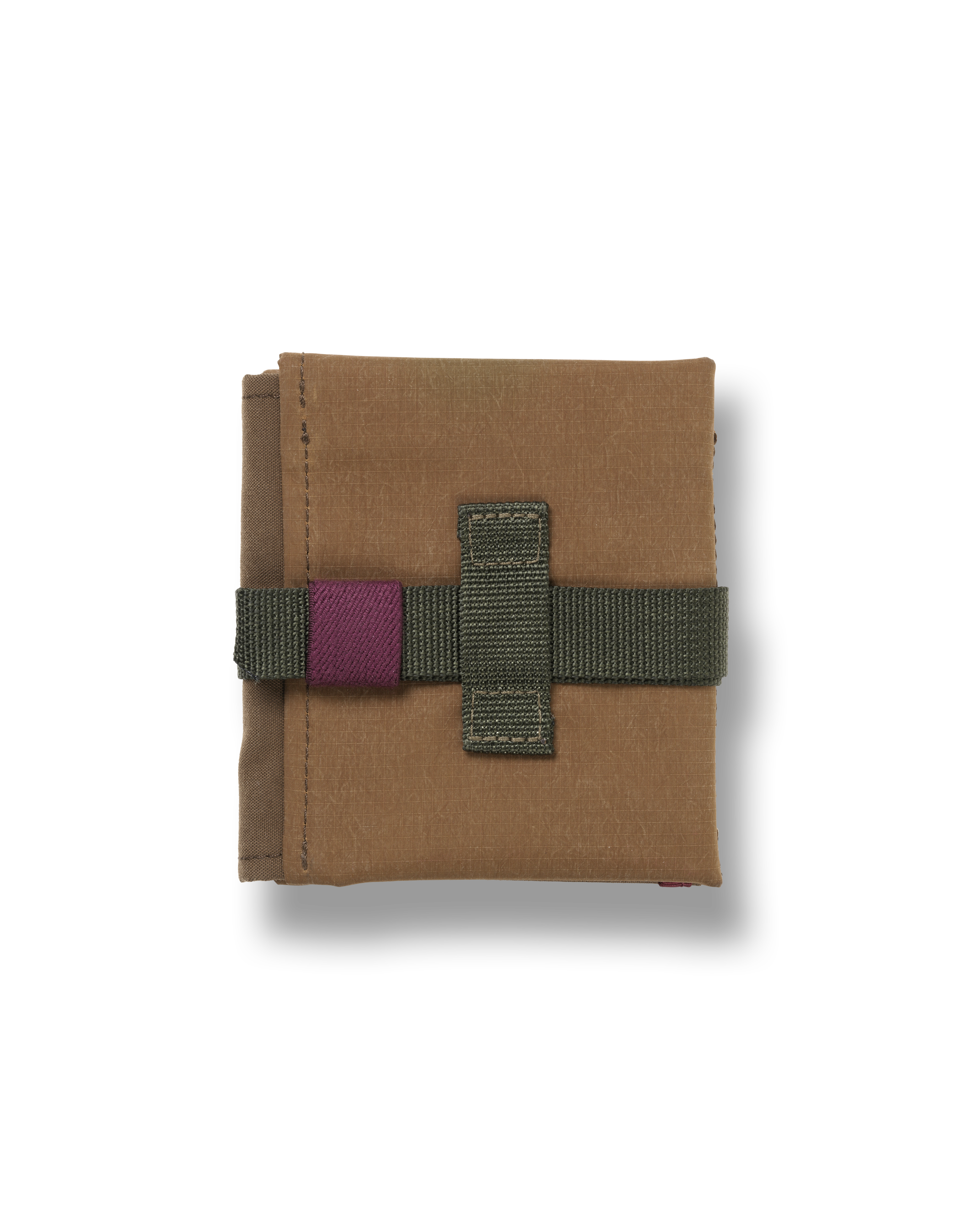 Light Brown Porter-Yoshida cycling saddle bag, folded flat with olive webbing strap and purple velcro closure