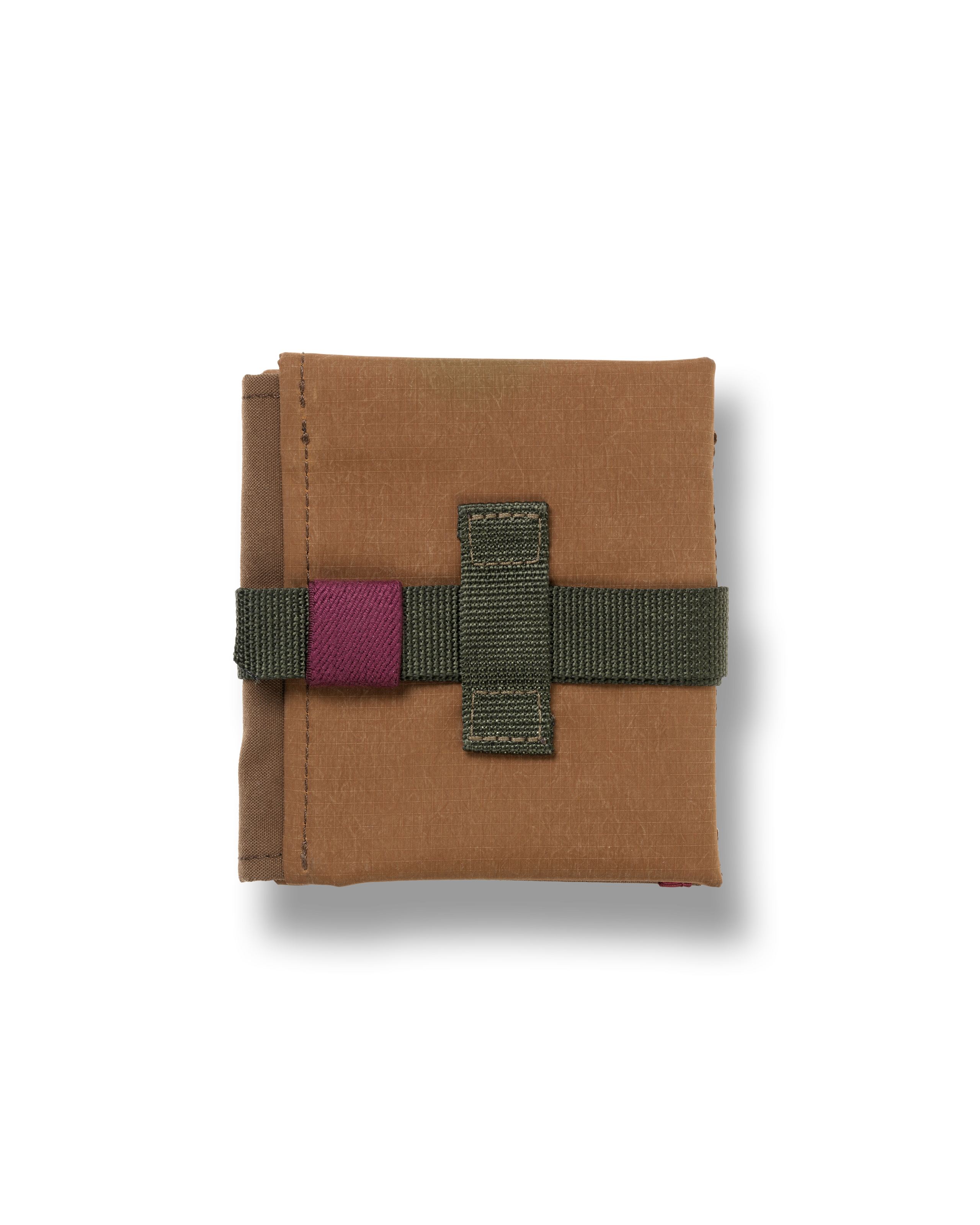Light Brown Porter-Yoshida cycling saddle bag, folded flat with olive webbing strap and purple velcro closure