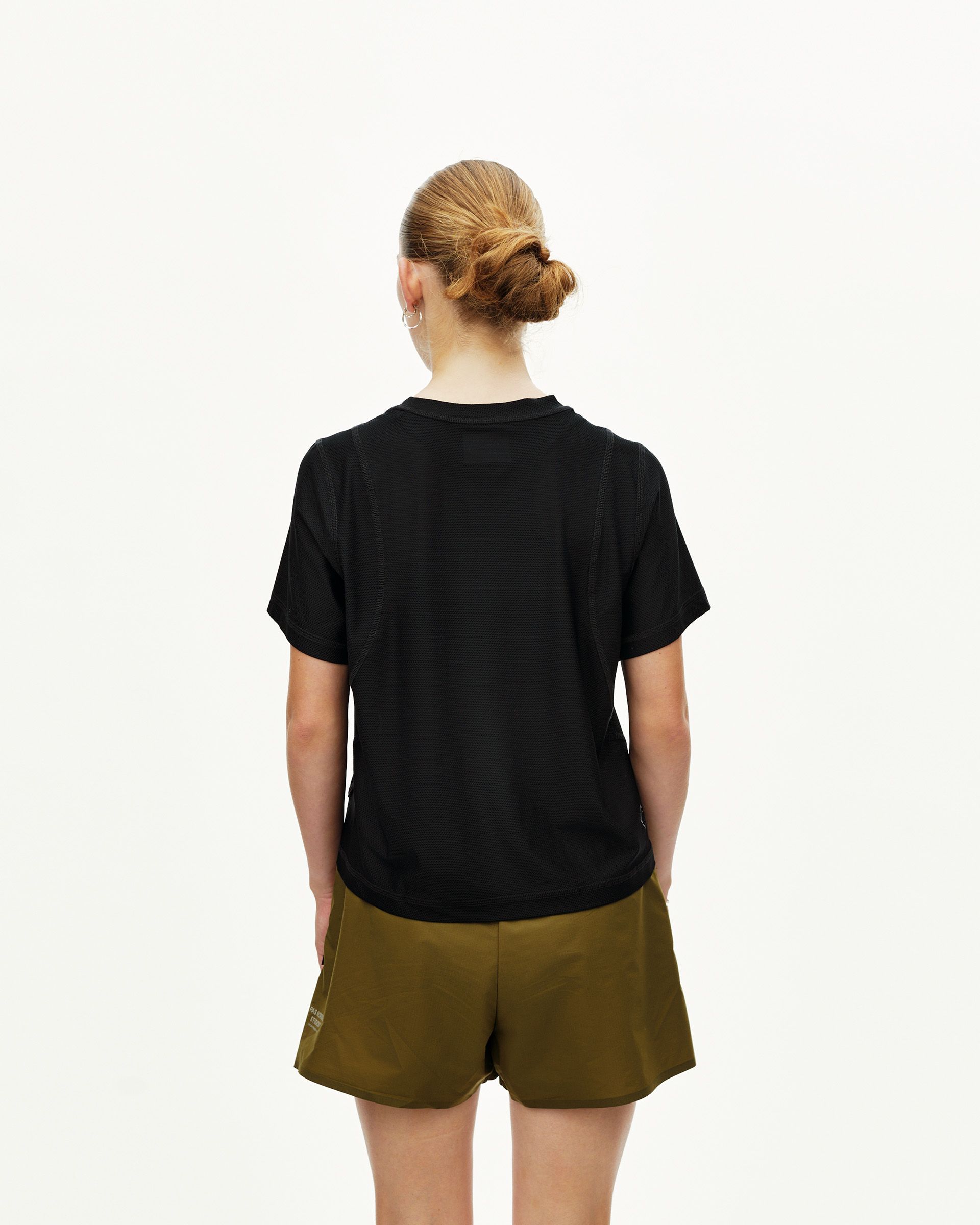 Black Balance T-Shirt on model, rear view with contrast seam stitching