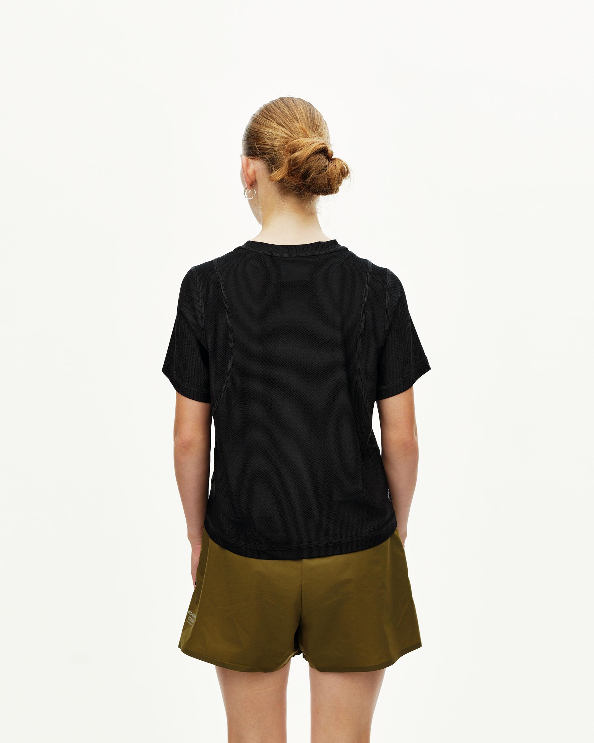 Black Balance T-Shirt on model, rear view with contrast seam stitching
