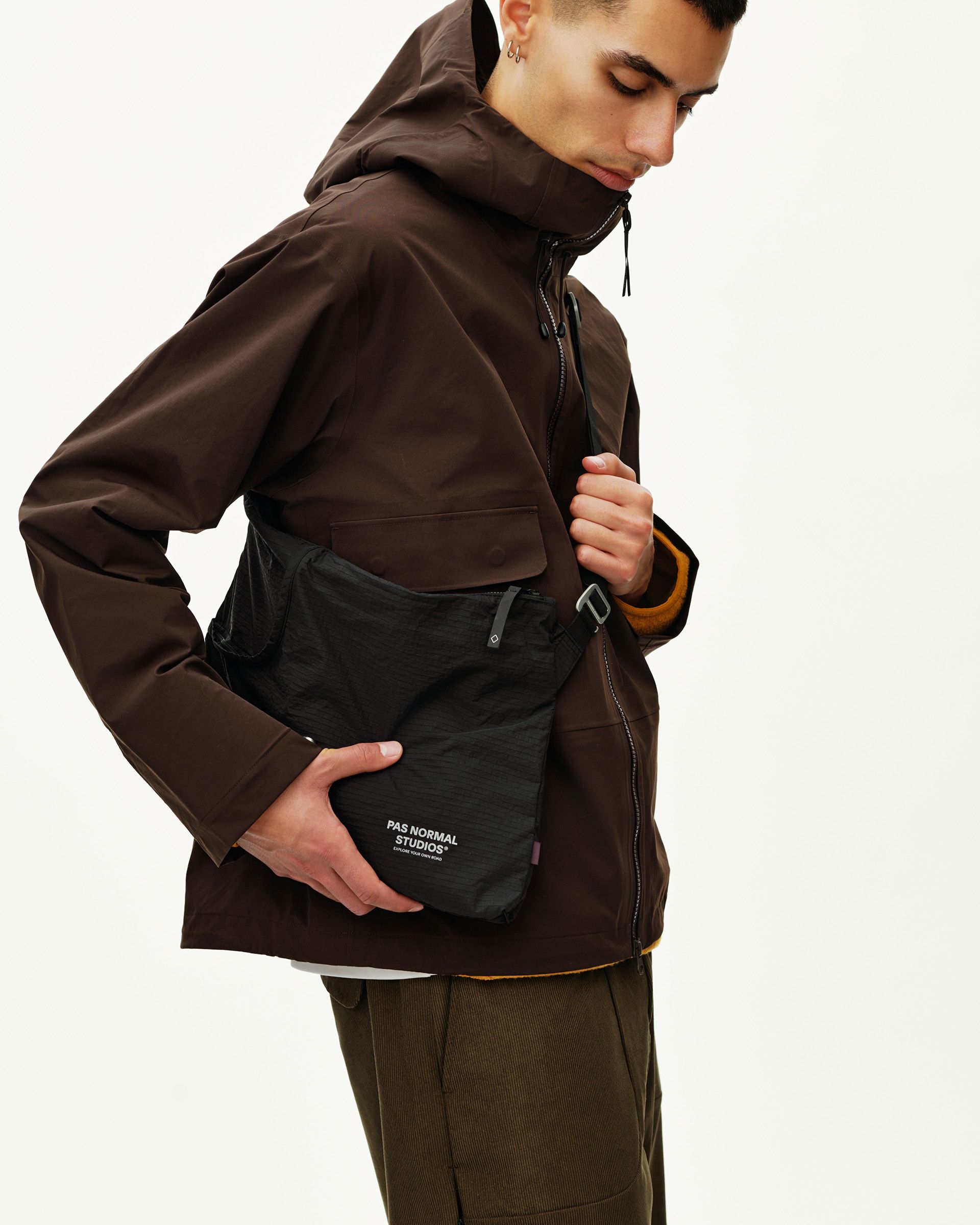 Black Off-Race Tech Musette 2.0 shoulder bag on model, side view with white logo print