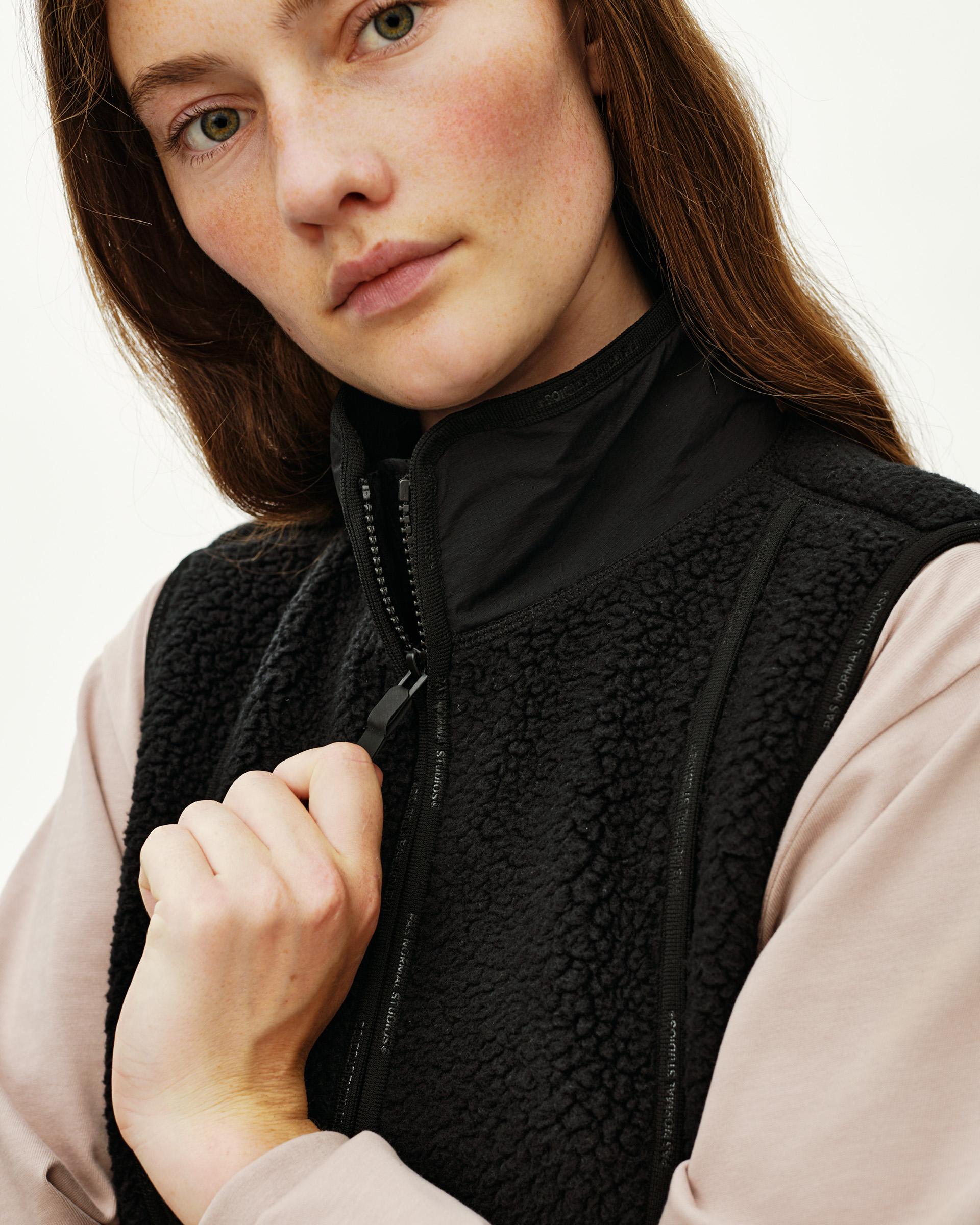 Black Off-Race Pile Fleece Vest on model, front detail view with full zip and sherpa texture