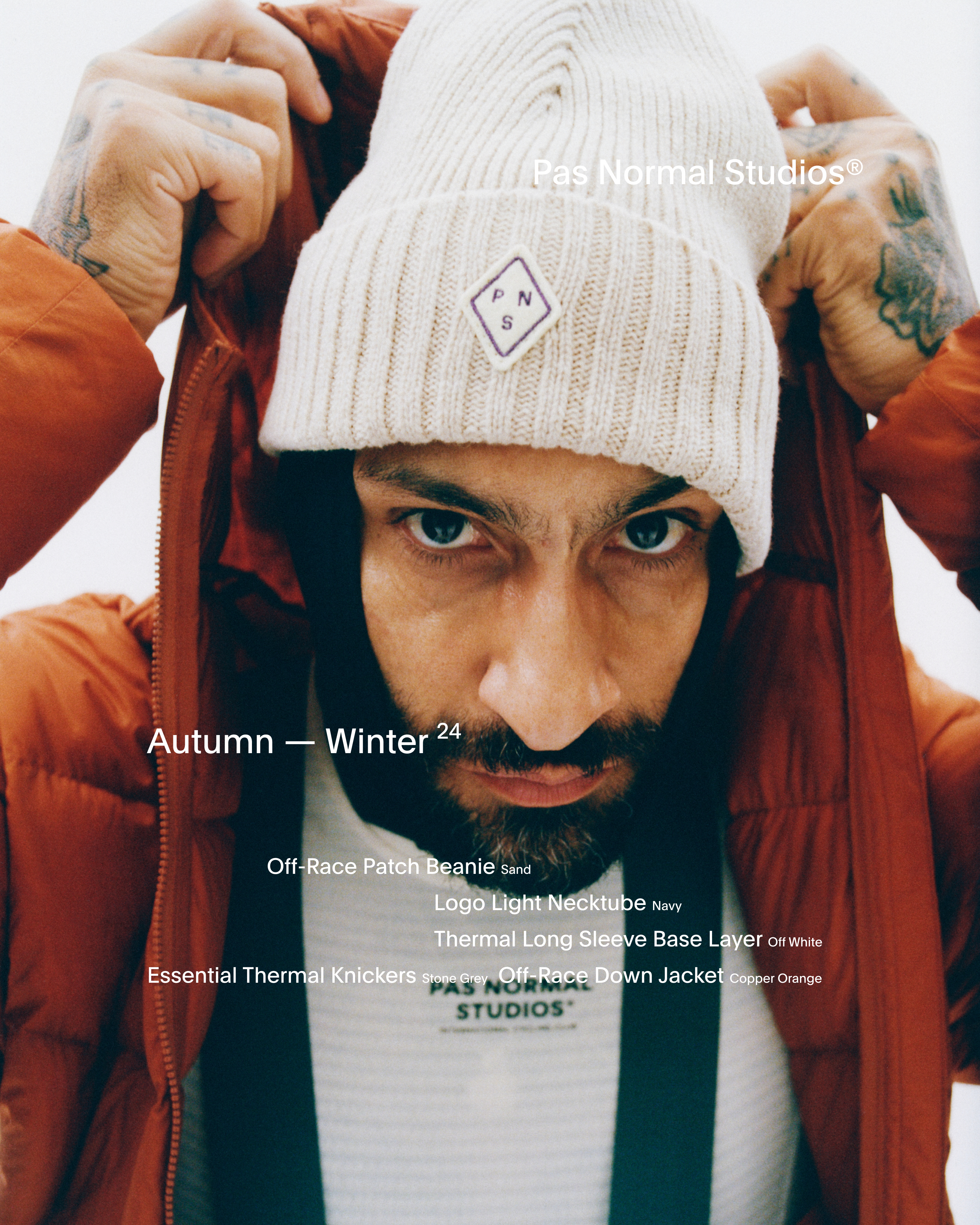 Model wearing Off-Race Patch Beanie in sand with ribbed knit texture and logo patch