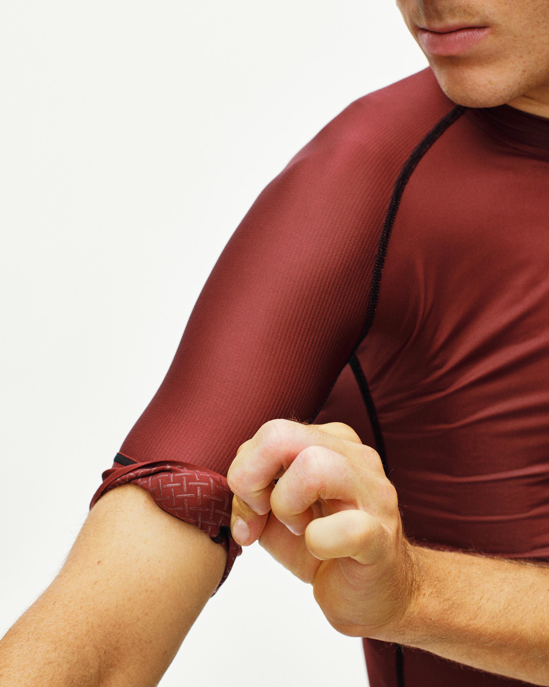 Maroon Mechanism cycling jersey on model with black contrast seaming