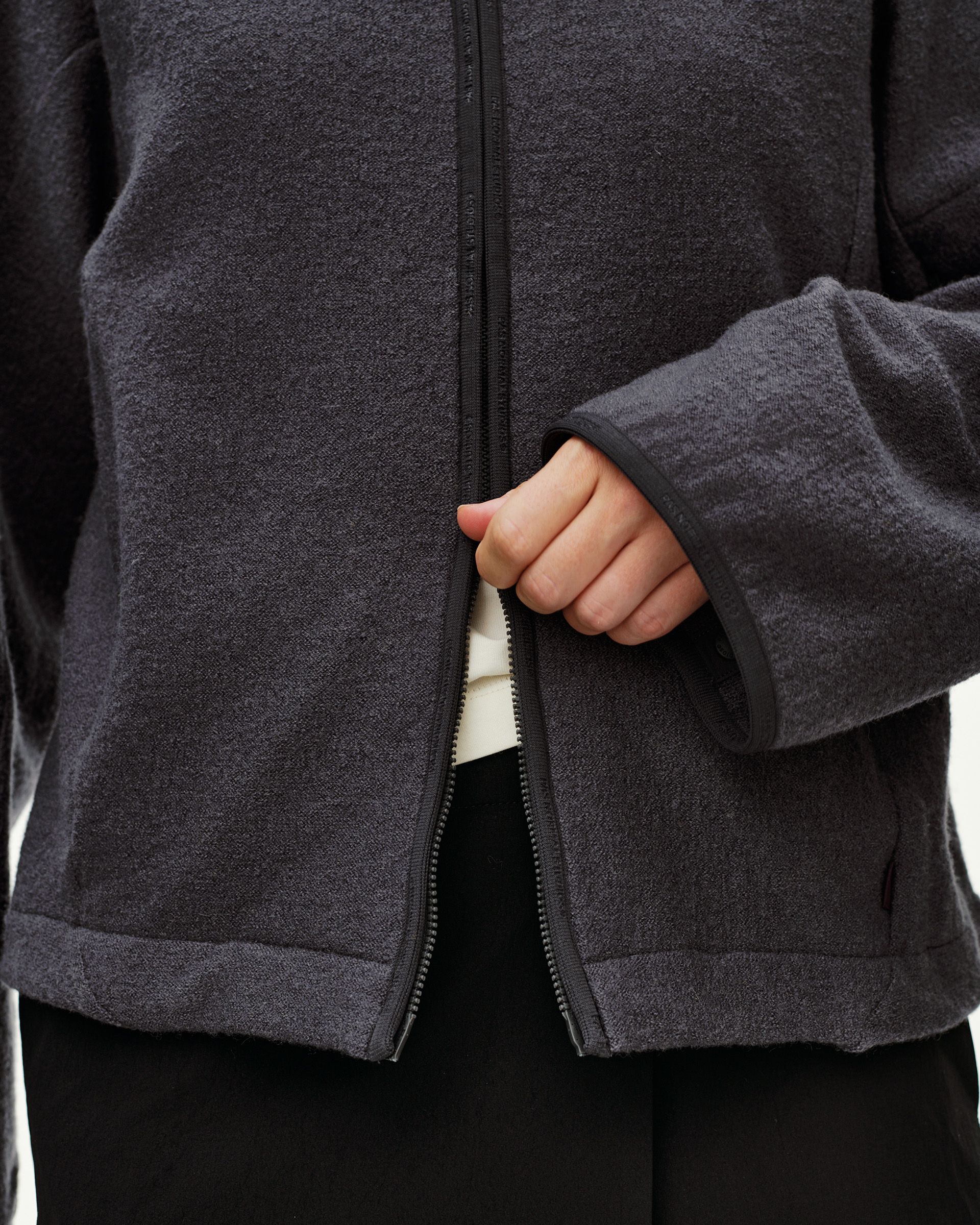 Steel grey Off-Race Boiled Wool jacket, front detail on model showing open full-length zip