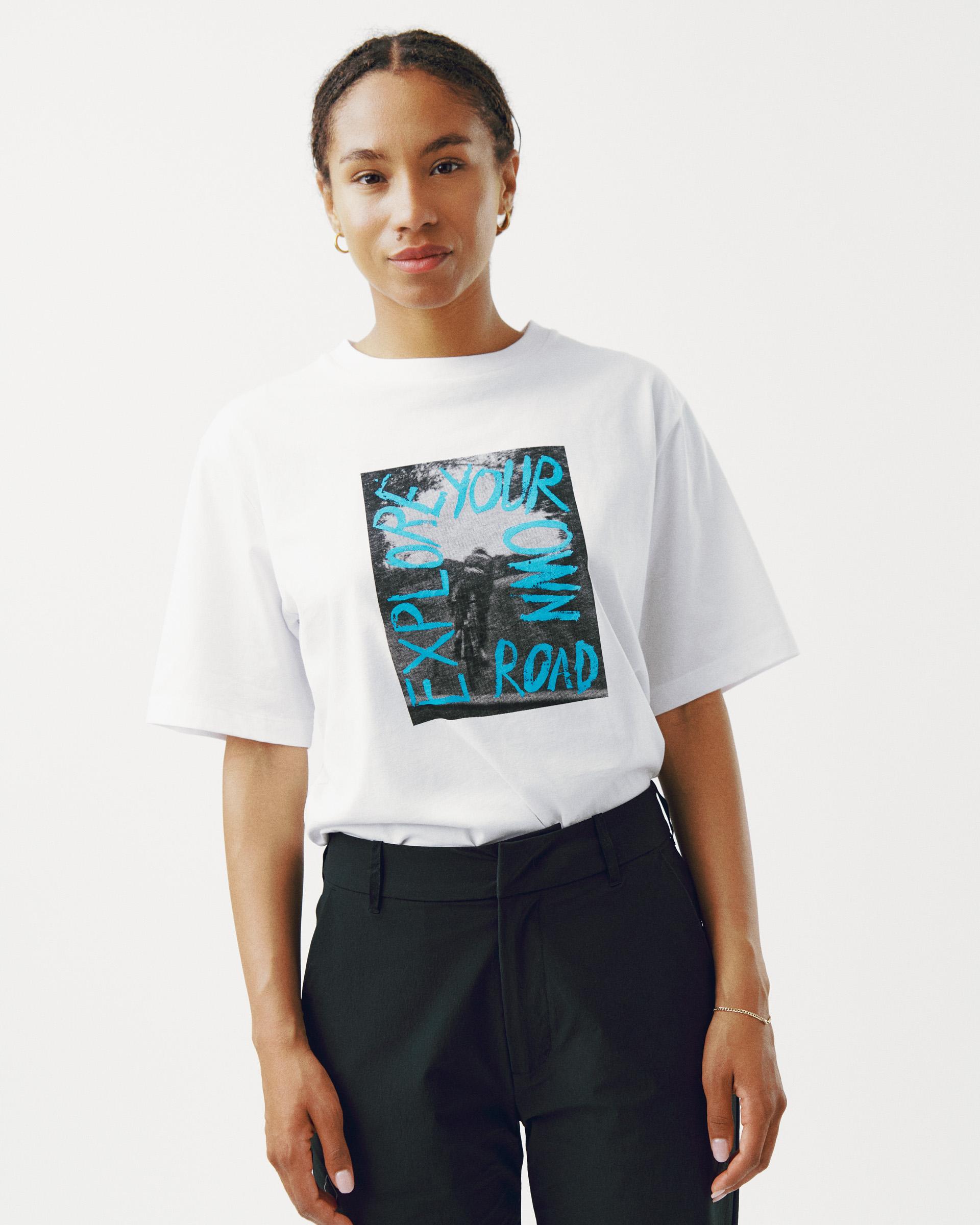 White Off-Race Graphic t-shirt on model with blue road cycling text print