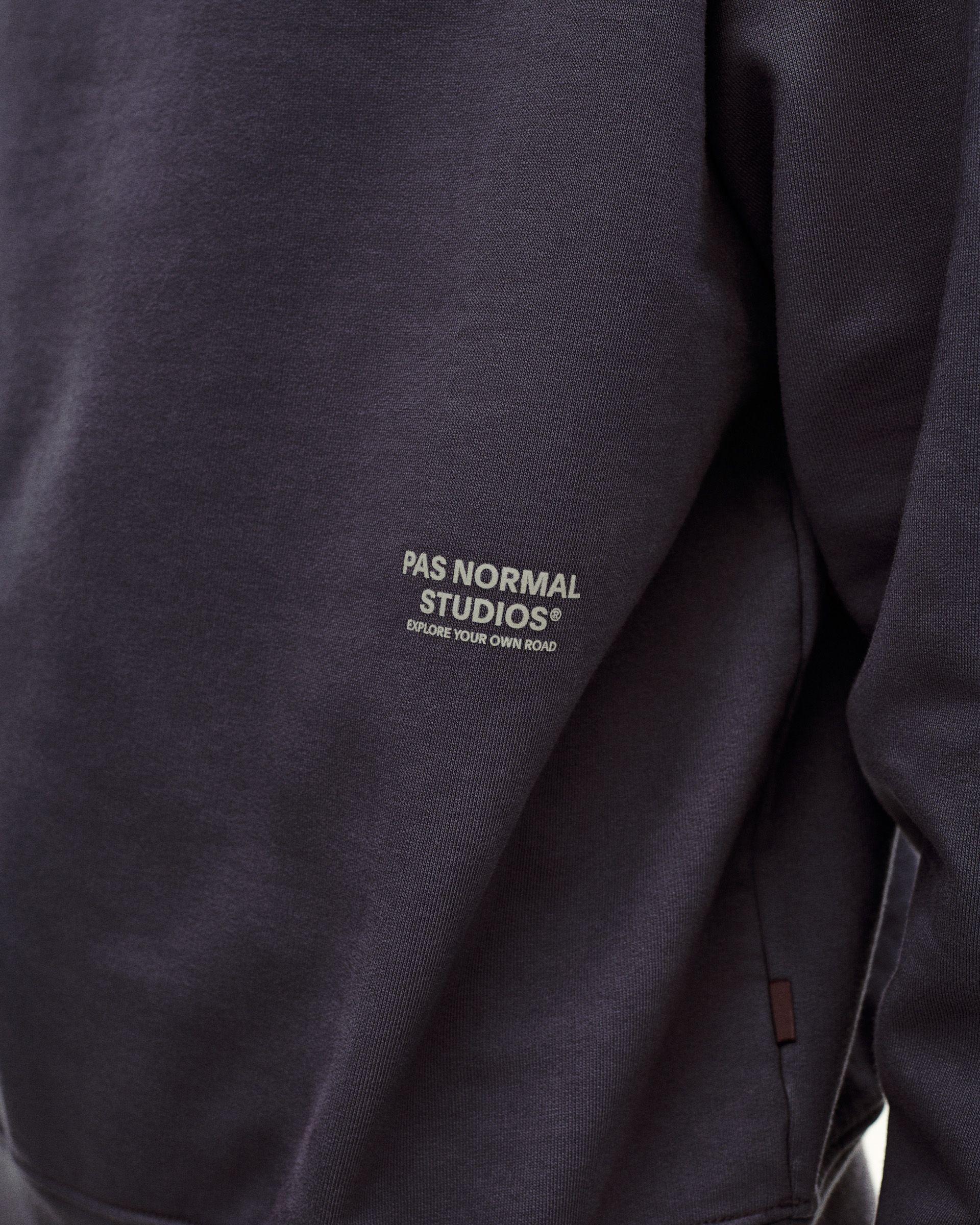 Grey Off-Race sweatshirt, detail view showing white chest logo and kangaroo pocket