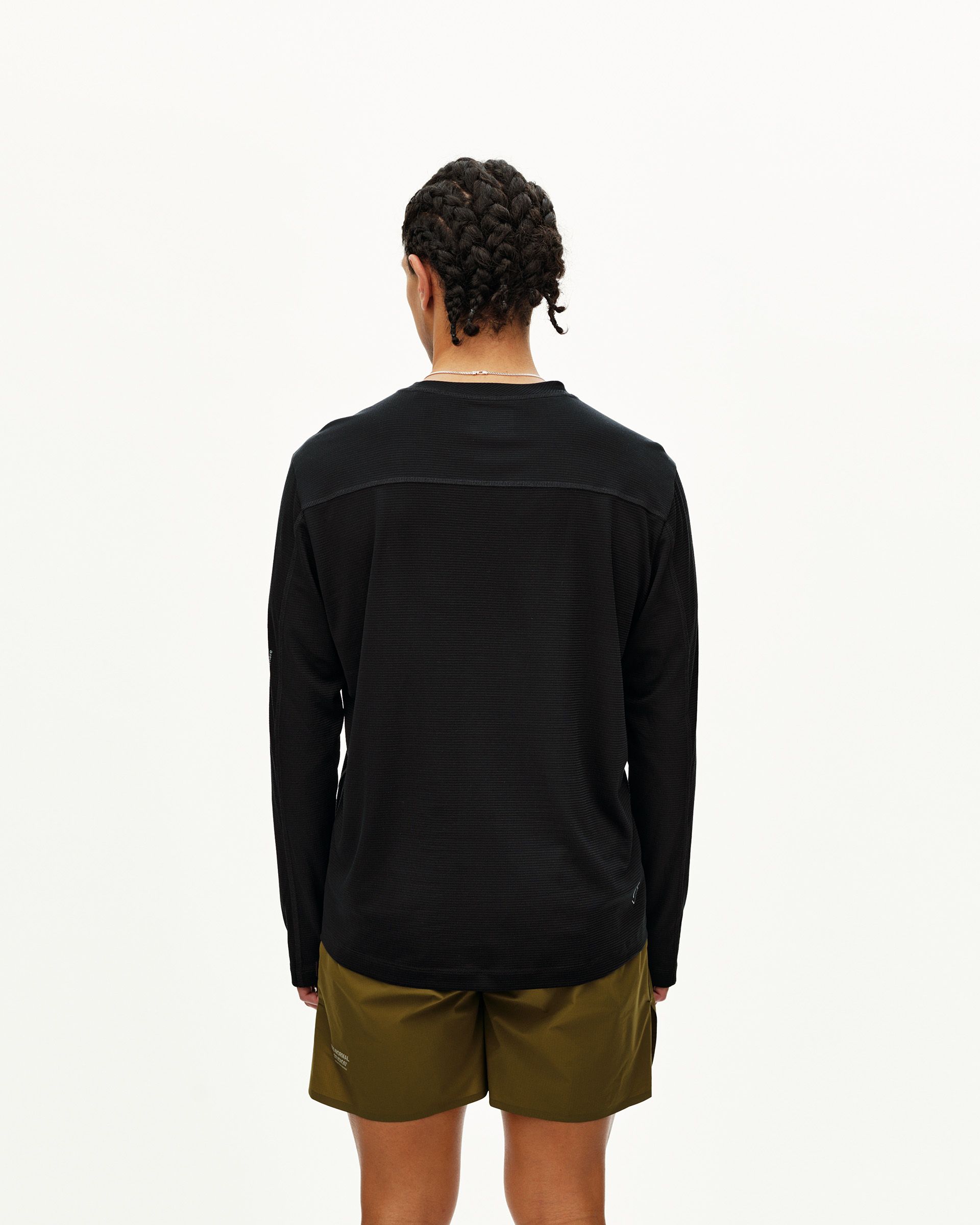 Black Balance Long Sleeve T-Shirt on model, rear view with contrast panel across shoulders