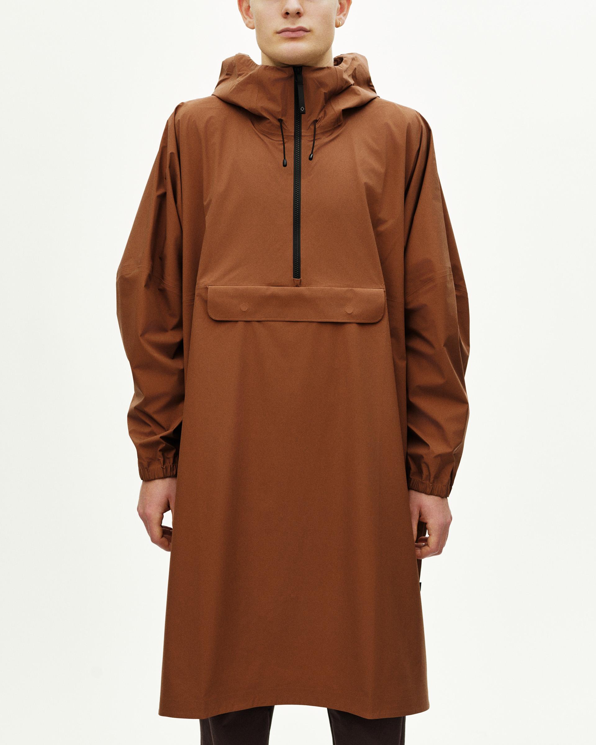 Brown Off-Race 3L Poncho on model, front view with half-zip and kangaroo pocket