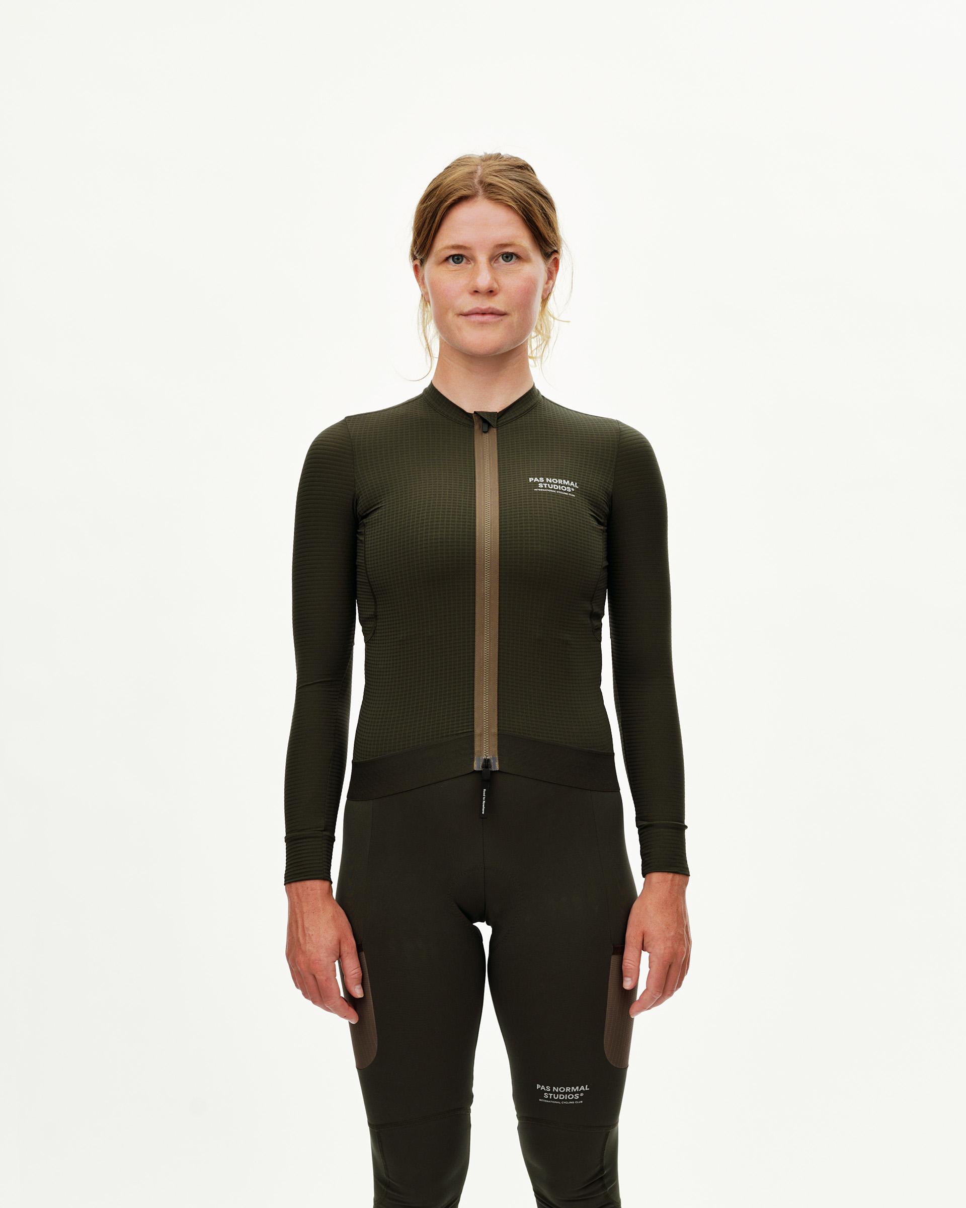 Dark Olive Escapism long sleeve cycling jersey on model, front view with contrast zip and grid texture fabric